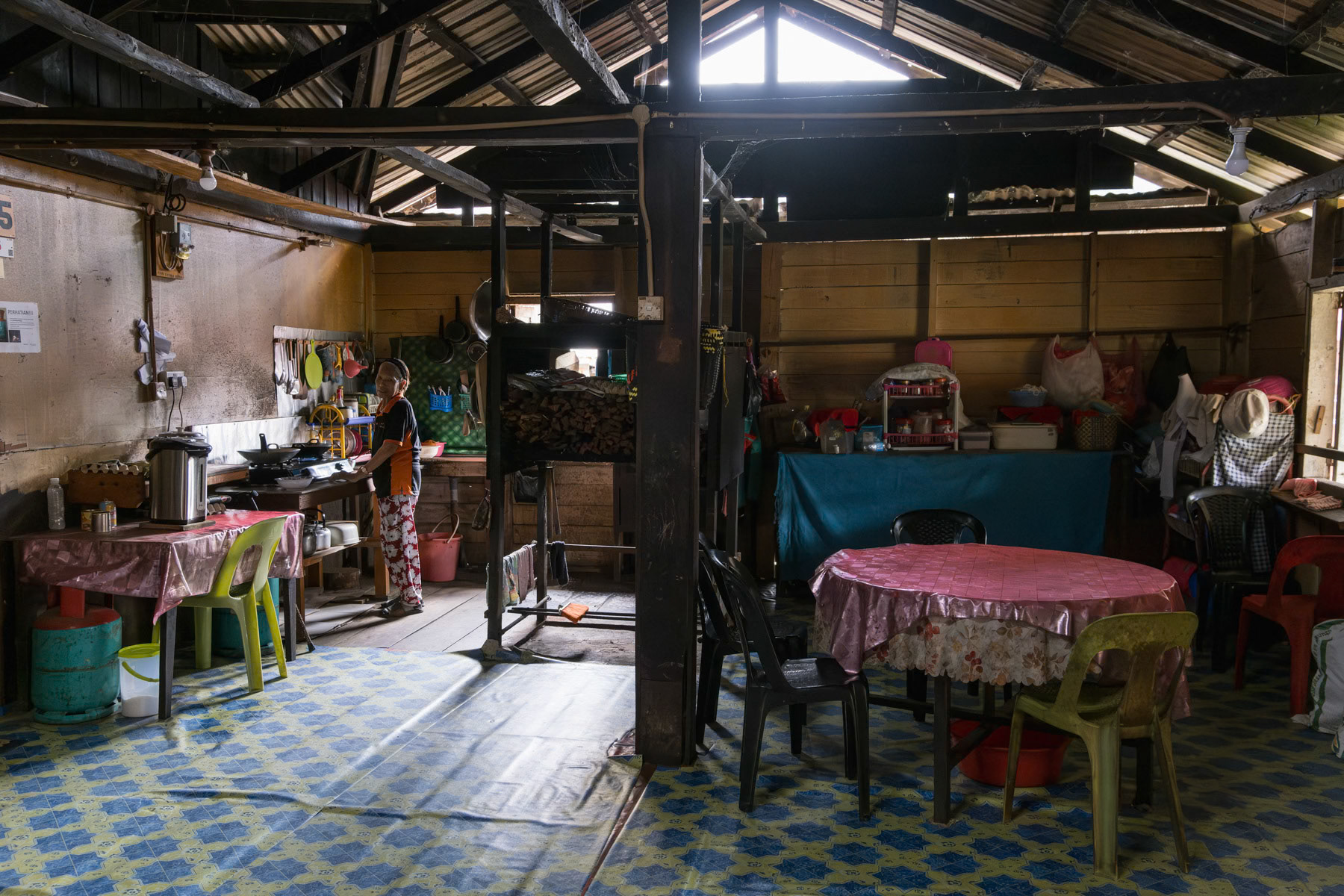 Interior of a traditional longhouse, the common habitat of indigenous people in Borneo. Bario, Sarawak, Malaysia, October 2023