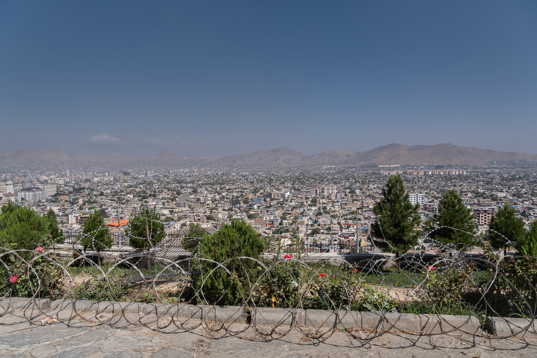 Panoramic view from Wazir Akbar Khan hill of Kabul city, surrounded by mountains. Kabul, Afghanistan, August 2024