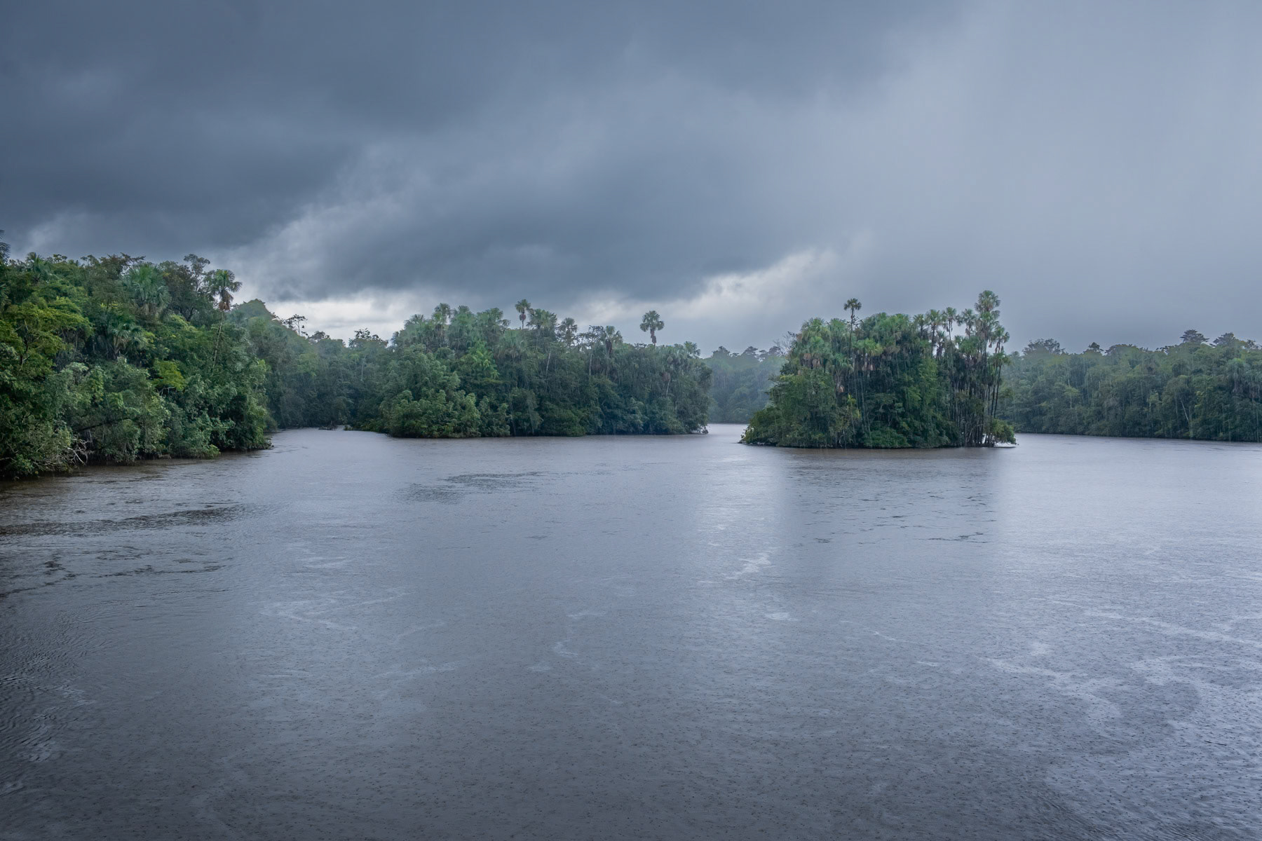 The Orapu river crossing the tropical rainforest part of the Amazon ecosystem in French Guiana, March 2022