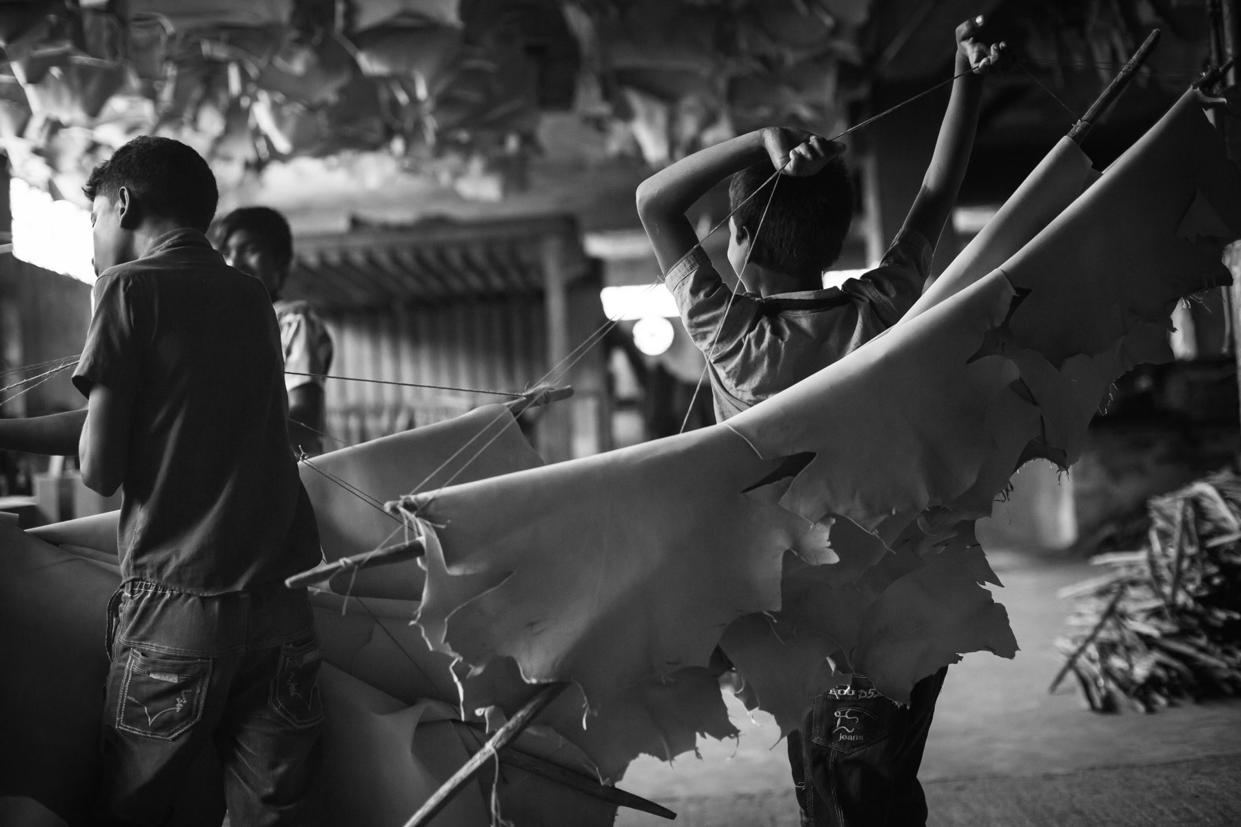 Children working in the skin drying space of the tannery, Hazaribagh, Bangladesh, May 2015