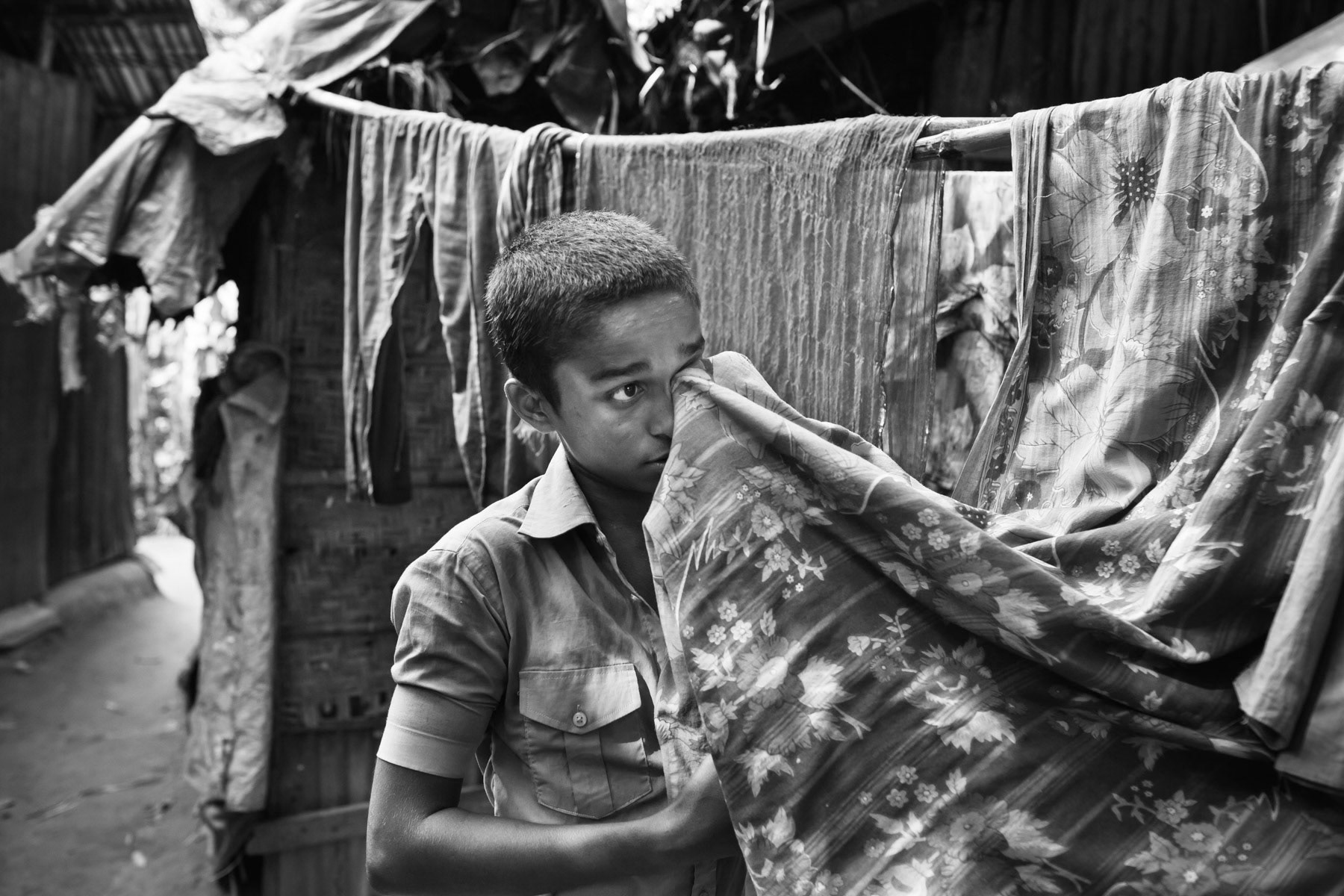 Fifteen year old boy working as helper on the ship breaking yards of Chittagong, Bhatiary, Bangladesh, October 2014