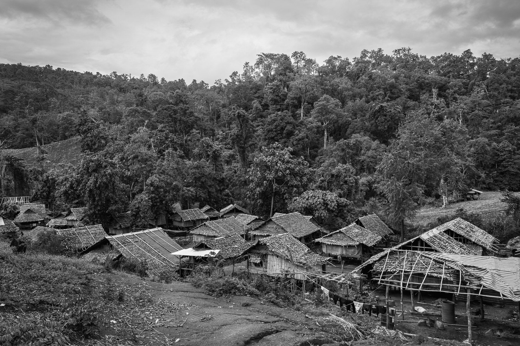 Karen families, internally displaced by relentless airstrikes and junta attacks, find temporary shelter here in Htaw IDP camp, only a short distance from the village they fled. Kanele, Karen State, Myanmar, May 2025