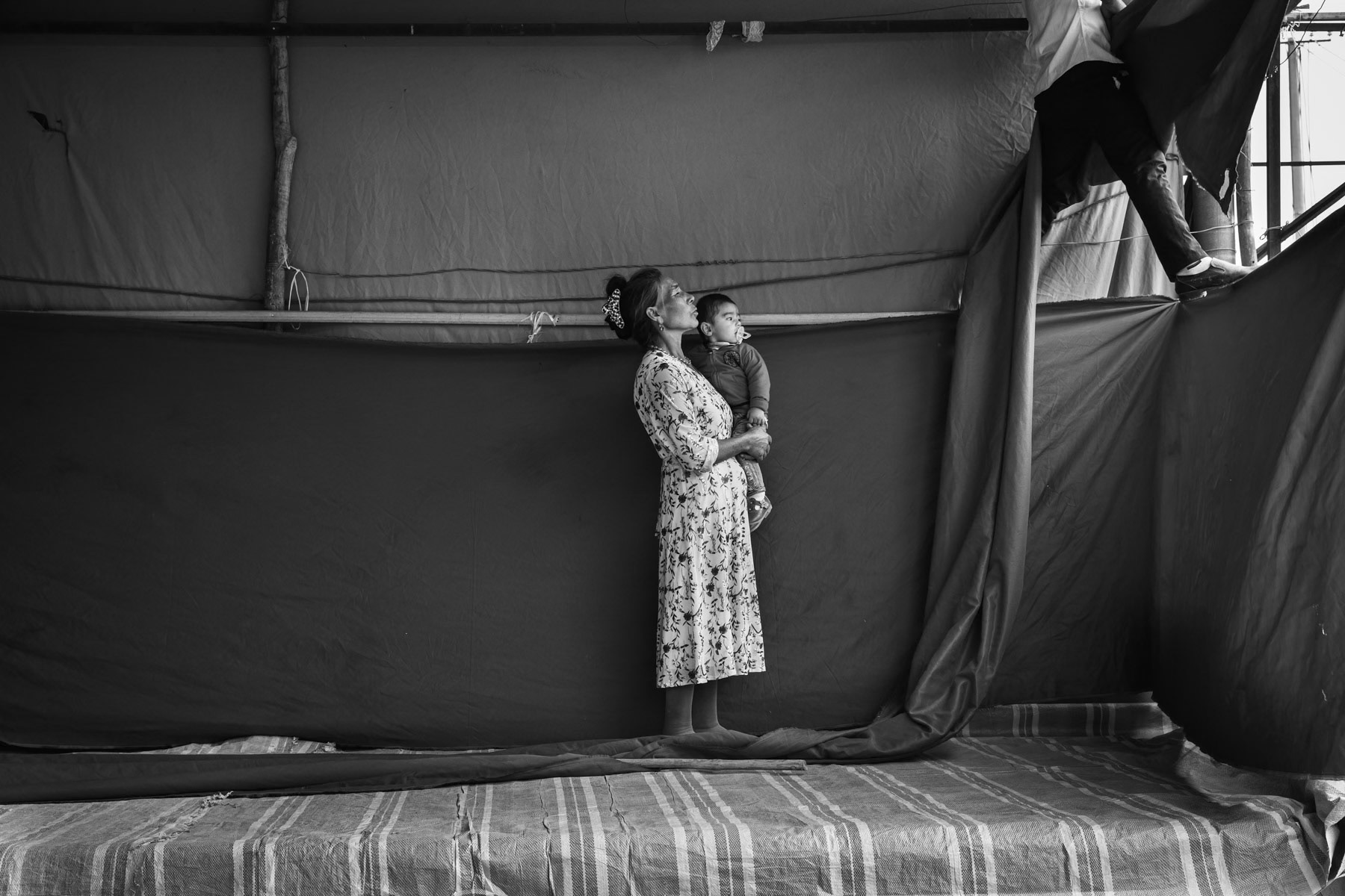An Uyghur family setting up their shop for the weekly regional market in Wupaer village. Kashgar District, Xinjiang, Western China, September 2019