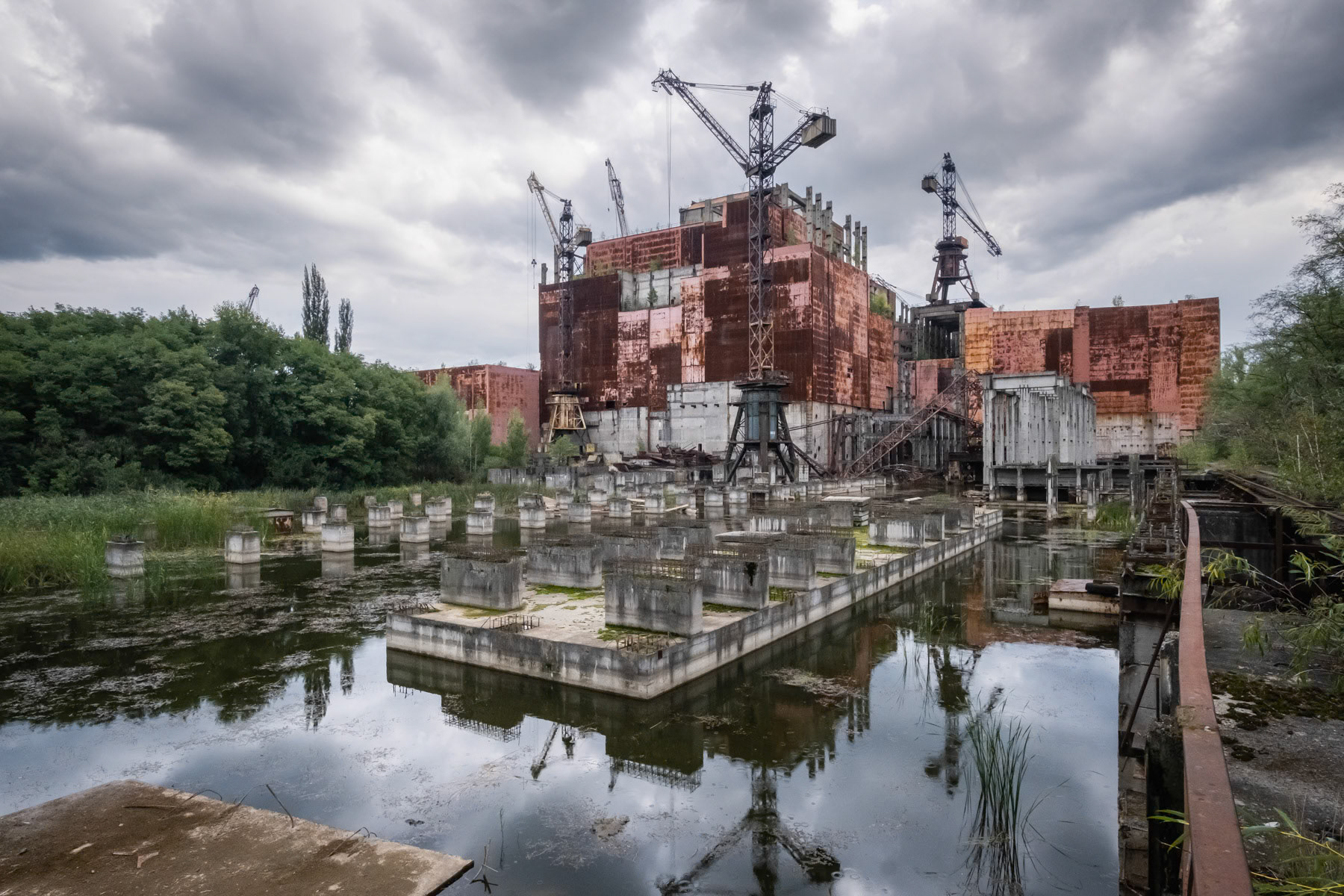 Unfinished nuclear reactor number 5 was supposed to be put in function in October 1986. After the explosion of reactor 4, all expansion works were stopped indefinitely. Plans existed to expand the Chernobyl nuclear power plant (NPP) to ten reactors by the year 2000 which would have made it the largest in the world. The accident of 26 April 1986 and later the collapse of the Soviet Union put a definite halt to it. Chernobyl NPP, Ukraine, September 2021