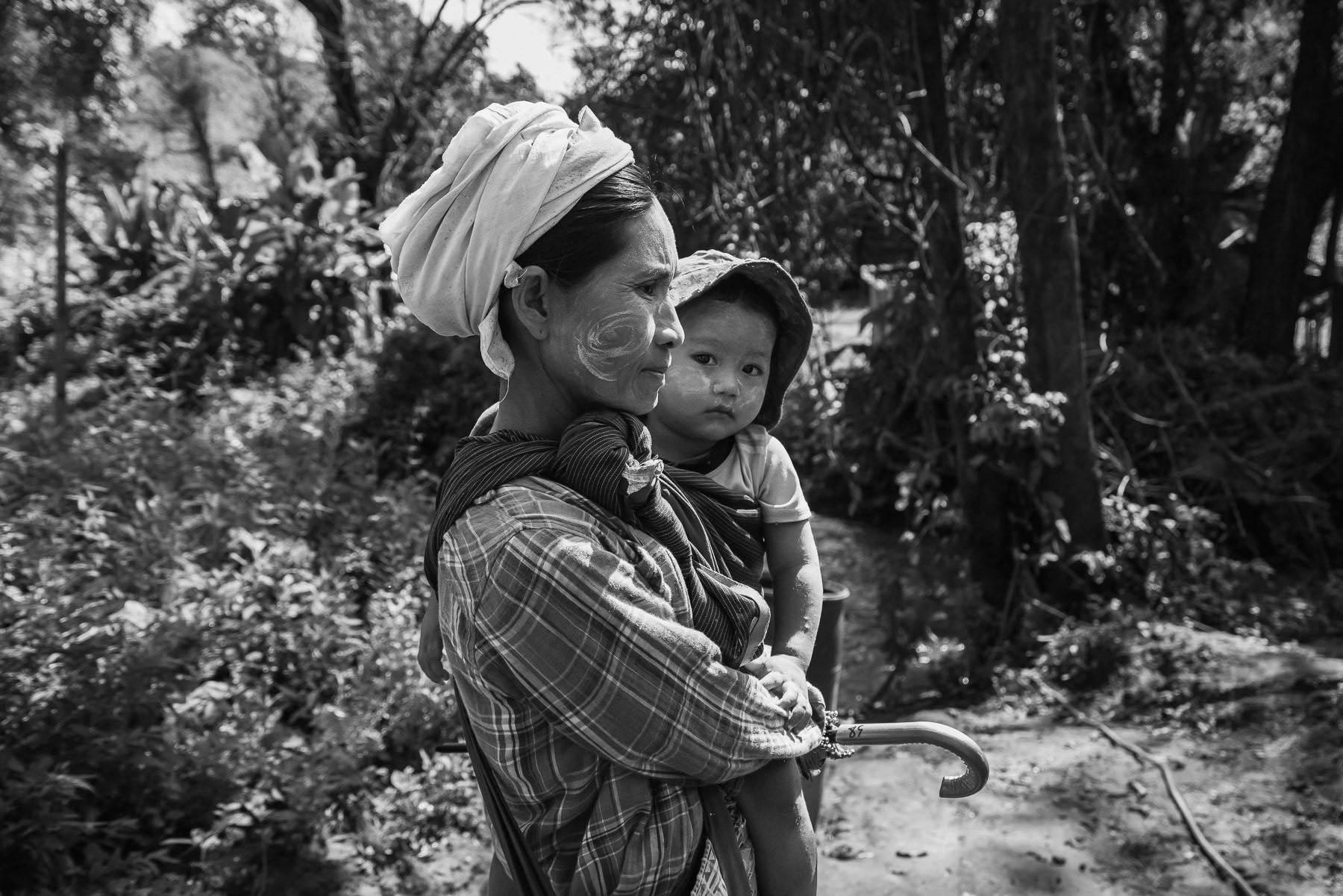 Karen mother and her child. Kanele Htaw IDP camp, Myanmar, September 2024