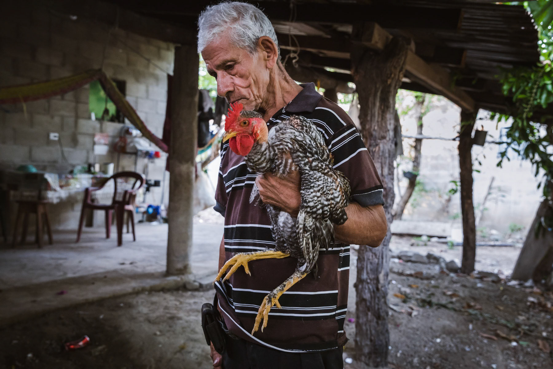 Magdaleno Serrano, 77 years, has a daugher from a first marriage whom he left with villagers when she was 5 years old and when he joined the guerilla movement. He saw her a last time in 1984 when she was seven before she was taken for adoption and ended up in the US. She was found 25 years later and came for the first time to El Salvador in 2009 when she was 32 years. He went to see her in the US in 2017. She was found and matched through Pro-Busquera, an organisation seeking the hundreds of children that have been abducted and dissapeared in adoption schemes towards the US and Europe. Arcatao, El Salvador, April 2019