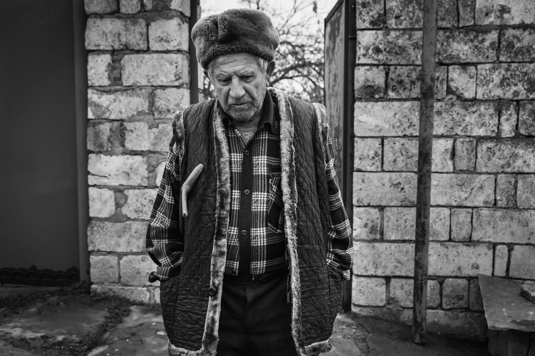 Roman, 84, did not want to abandon his native village of Khramort and stayed throughout the 44 day war. All civilians were evacuated from the area as it was and still is on the frontline. "I wanted to be close to my sons who were fighting on the battlefield" he says. Today Russian doctors visited him and said he has a heart condition and should seek further help at the hospital in Stepanakert. Stepanakert is now more than 90 minutes away due to roads that now pass through Azerbaijani controlled territory. Khramort village near Aghdam, Nagorno-Karabakh, December 2020