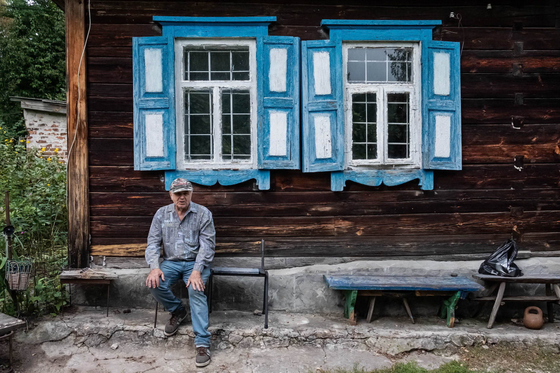 A self-settler or 'samoseli' who as an original habitant of villages in the exclusion zone is allowed to live in certain areas of the exclusion zone where the radiation levels are low and safe. Chernobyl town, Ukraine, September 2021
