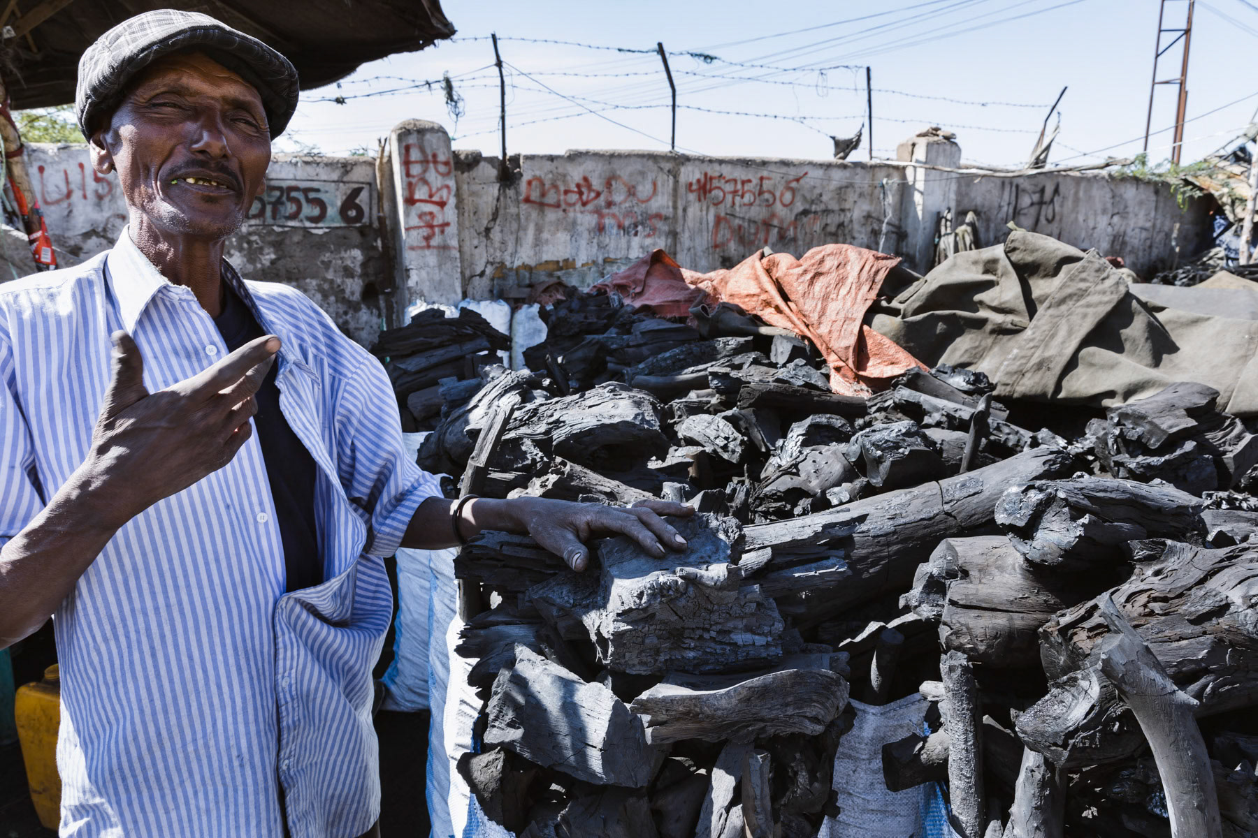 Charcoal seller. Charcoal is the main fuel used for cooking in Somaliland, but has a desastrous environmental impact, accelerating the already very advanced deforastation. Hargeisa, Somaliland, October 2017