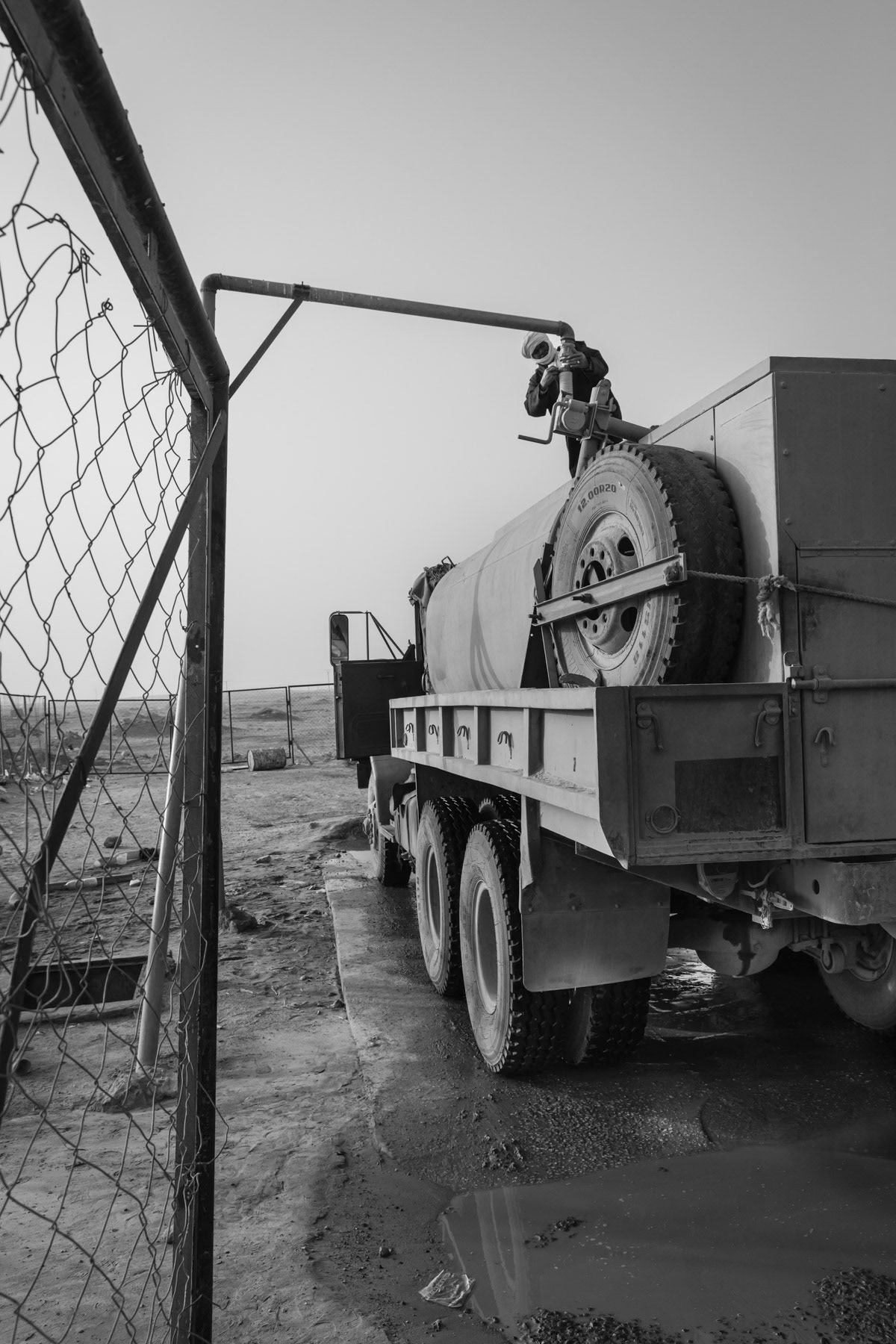 A water truck being re-filled at the Boujdor filling water station. For the past 45 years since the refugee camps were established water is only available through truck distribution and the filling of individual household tanks. Boujdor Refugee Camp, Algeria, October 2021
