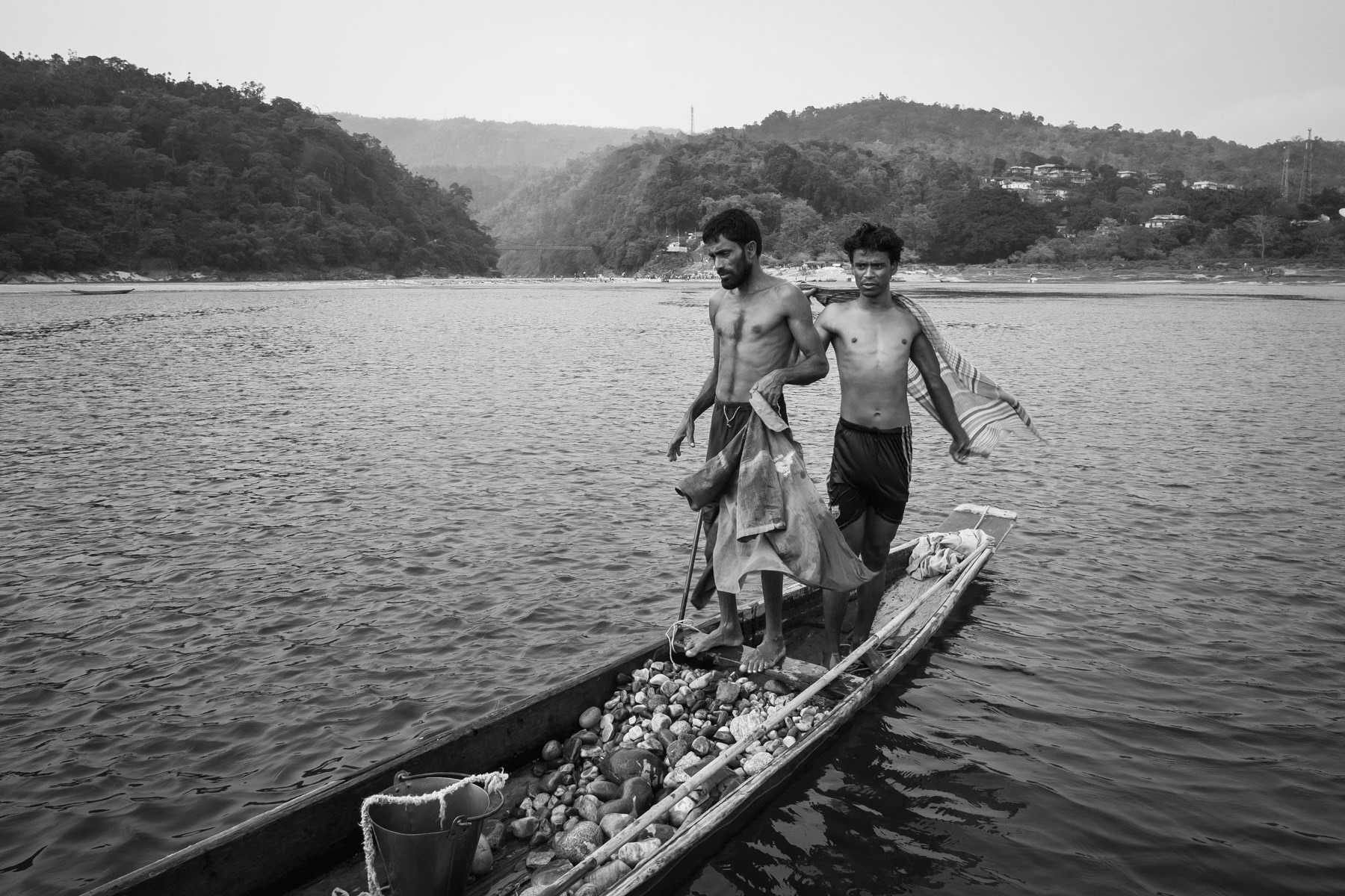 Stone divers recovering stones from the riverbed. Goyain river in Jaflong, Bangladesh, May 2016