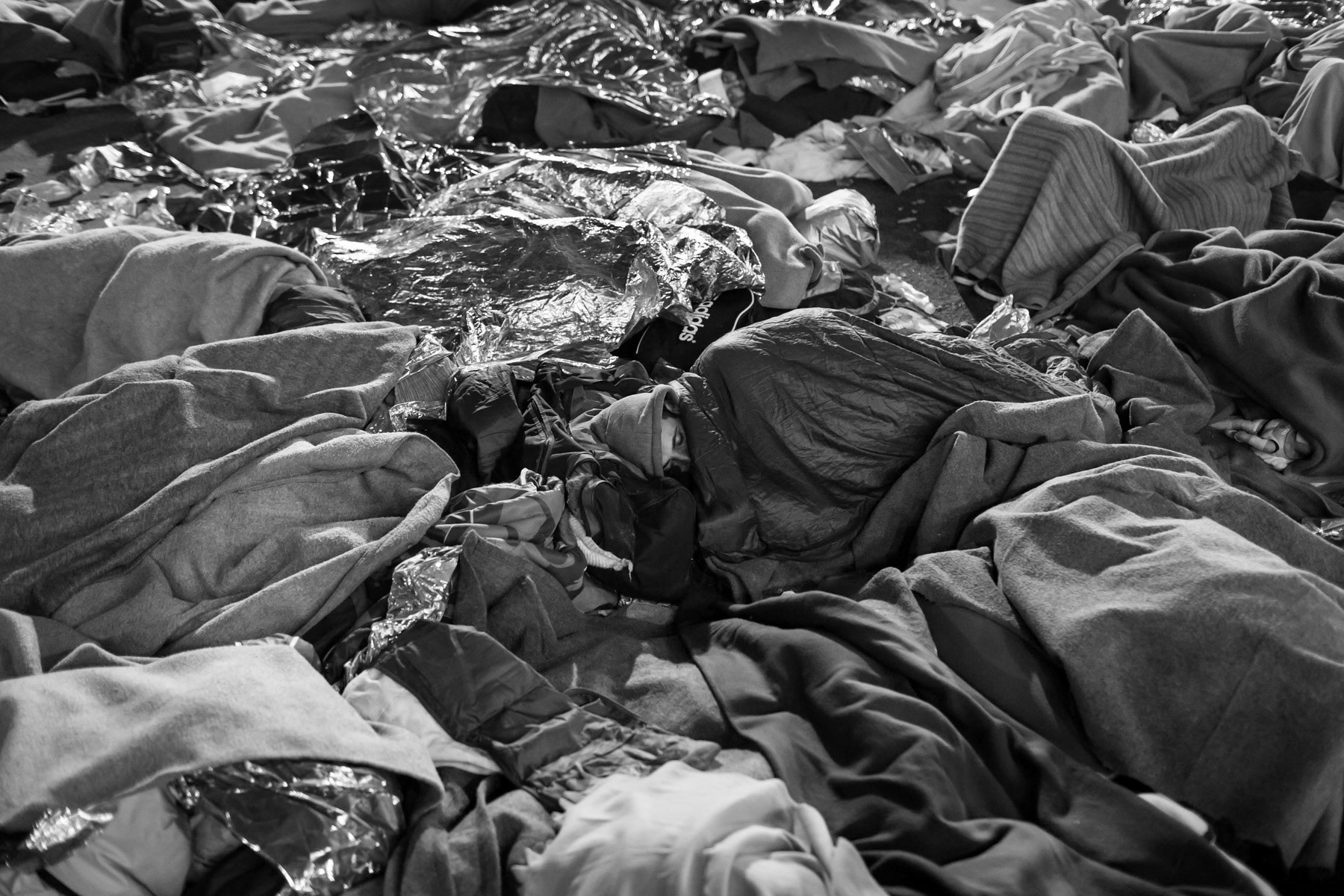 Refugees sleeping rough in Spielfel, main crossing point between Slovenia and Austria after Hungary sealed its border for refugees, Austria, October 2015
