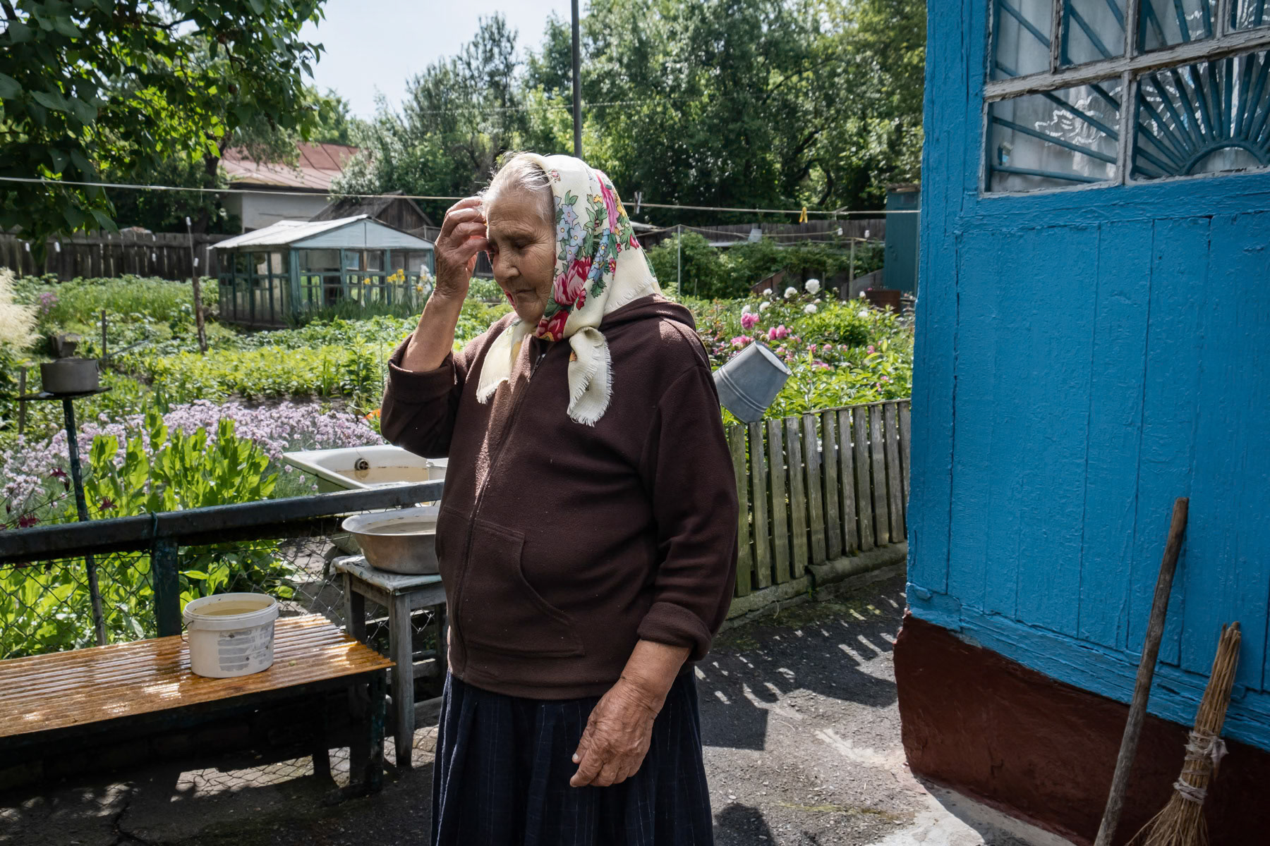 Maria, 84 years old, was a cleaner in schools before the accident and in a garage just after. Stayed away from the exclusion zone after being evacuated for only 1 month and came back in June 1986. Has lived for the past 65 years here where she now continues to take care of the house and garden. She lives alone and stays all year in Chernobyl and doesnt want to move from there. Her son and grandchildren live near Kyiv and come to visit once in a while but not as often as she would like. Chernobyl town, Ukraine, June 2021