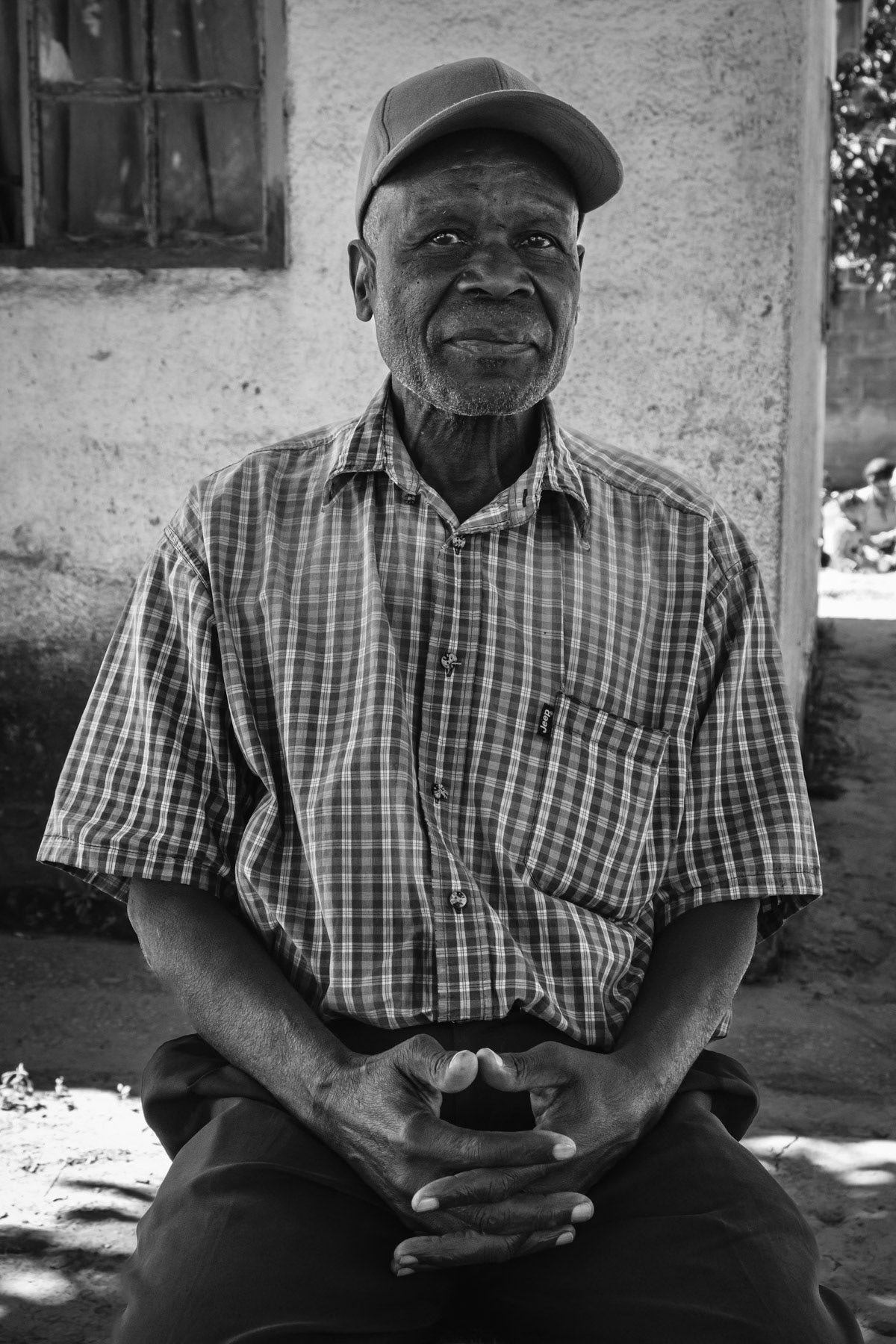 Enock Kawanga started to work in the mining industry in 1972, first in the Copperbelt and since 1983 in Kabwe. He worked until closure of the mine at metal production. Officially the mine was closed in 1994 for lack of lead and zinc, however the mine was reopened partly as a private venture in 2000 headed by the same person that was general manager when the mine was closed in 1994 for not being profitable. This situation has left a very bitter taste for all miners that were laid off in 1994 without prostect of receiving a pension or needed assistance. Kasanda district of Kabwe, Zambia, May 2021