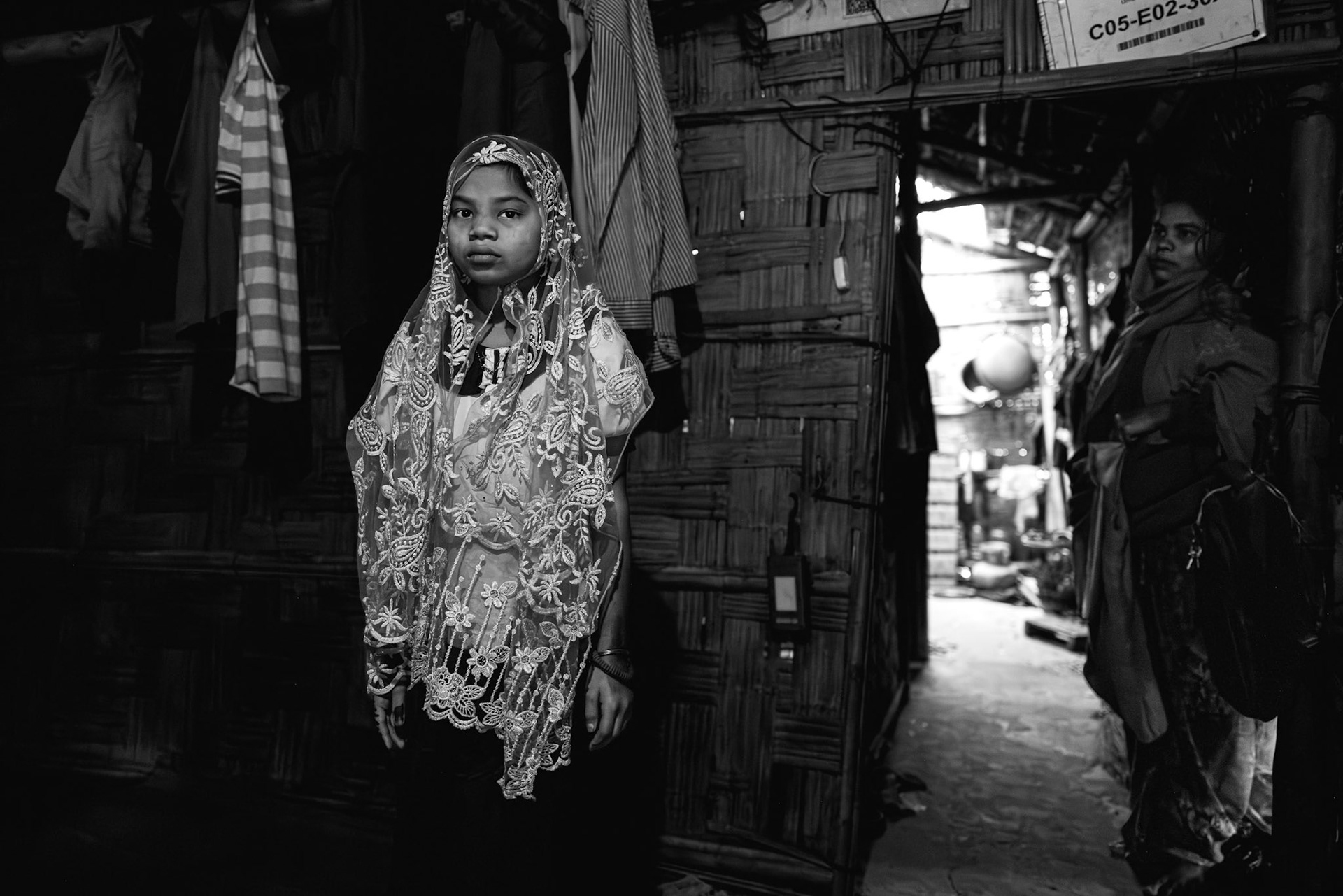 Safa Nur, now 12 years old, was only a toddler when she fled Southern Maungdaw for Bangladesh in 2017. She arrived as a three-year-old survivor of a shotgun wound, a physical reminder of the violence that displaced her family. Nearly a decade later, Safa continues to carry the deep psychological trauma of her early childhood. Despite her urgent need for specialized medical follow-up to address her injury and its long-term effects, accessing adequate care within the refugee camps remains a significant challenge. Kutupalong camp, Cox's Bazar, Bangladesh, January 2026