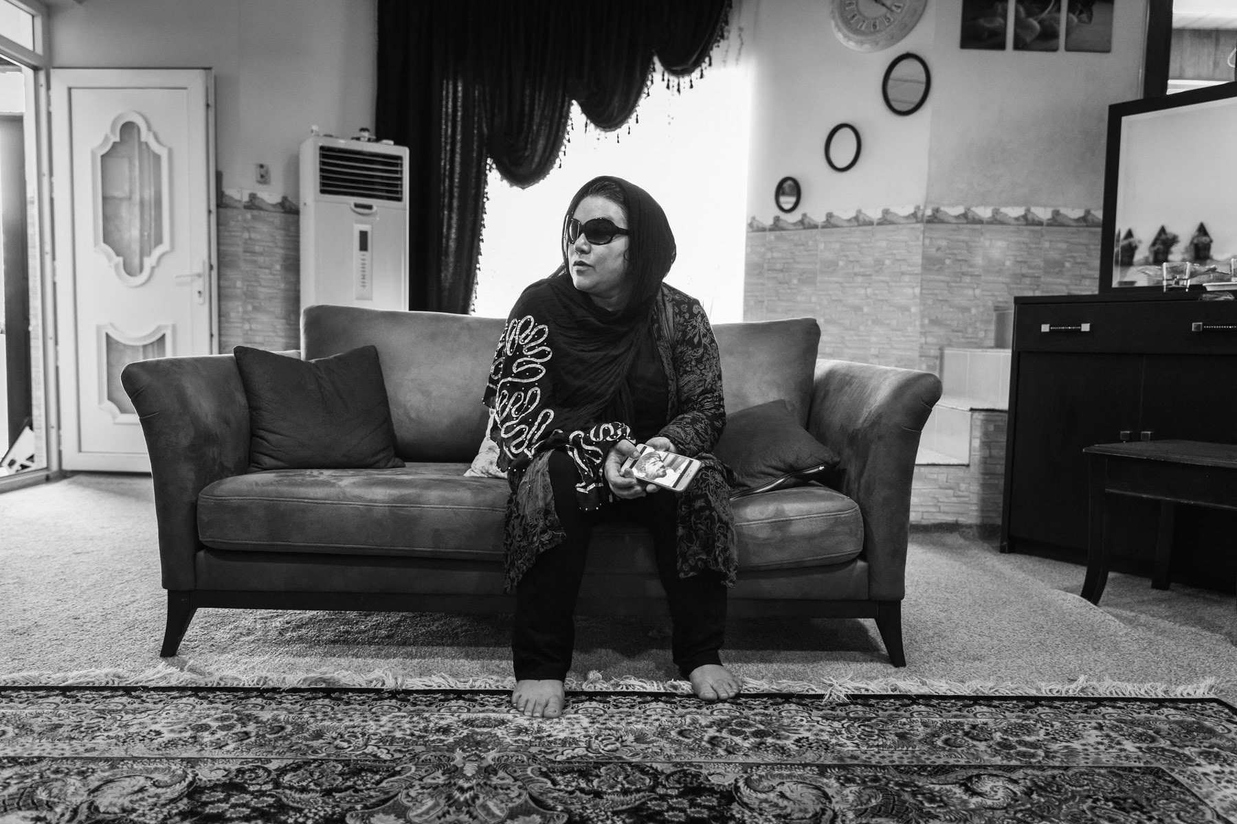 Alwan, 38 years, victim of the Halabja chemical attack in 1988. She recently underwent cornia surgery in Teheran. She works as a volunteer at the memorial center where she found footage of herself in the aftermath of the attack. She lives now still in Halabja and is married and has 2 children. Halabja, Kurdistan, Iraq, August 2018