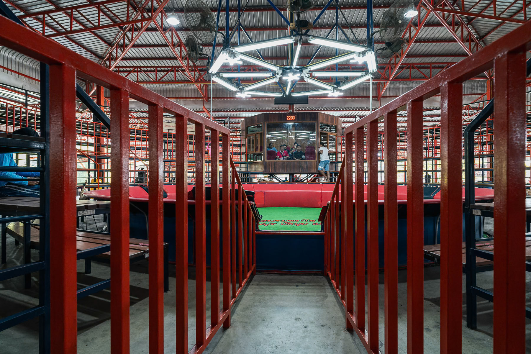 The main arena before the rooster fights with its lounge for local VIPs. Kanchanaburi rooster fight arena, Thailand, January 2025