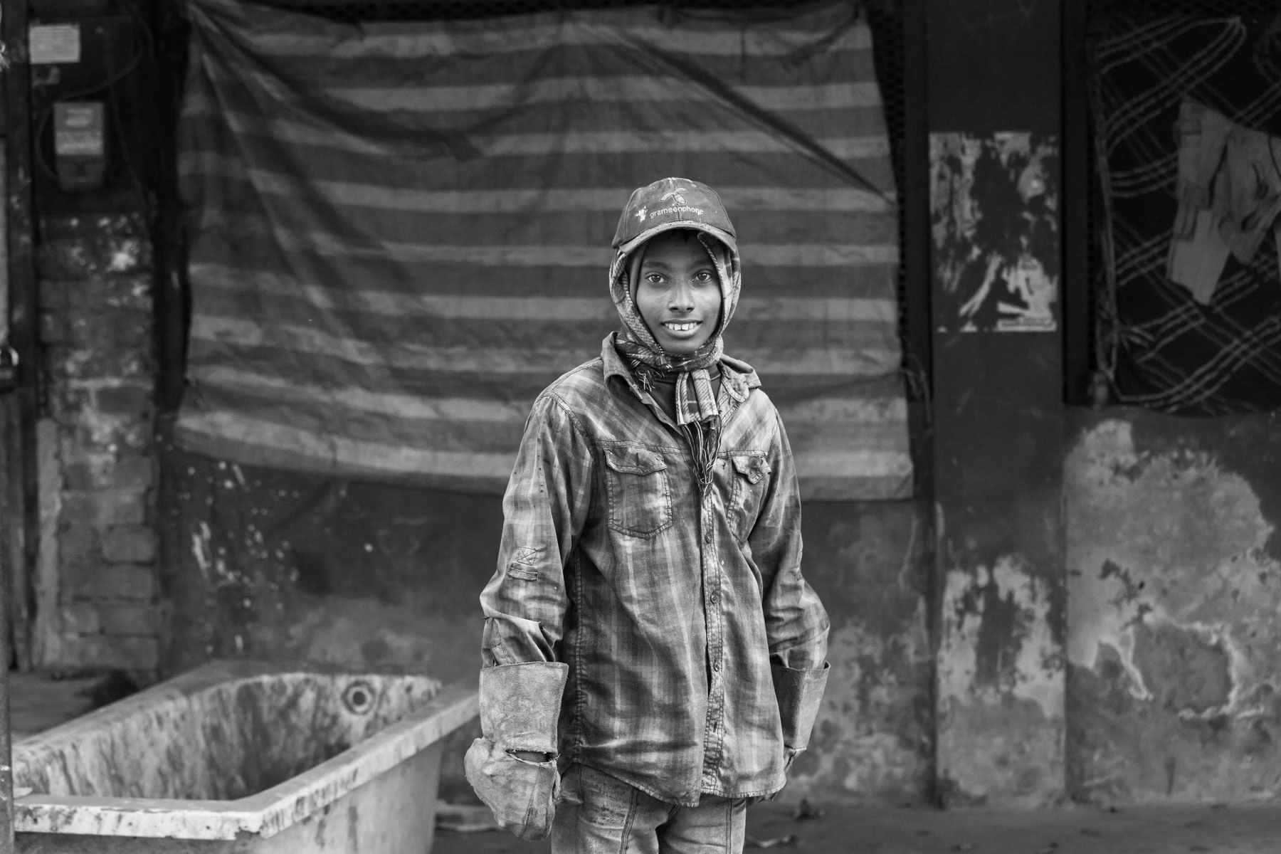 Minor employed as a ship cutter assistant despite child labour regulations, ship-breaking yards of Bhatiary in Chittagong, Bangladesh, December 2015