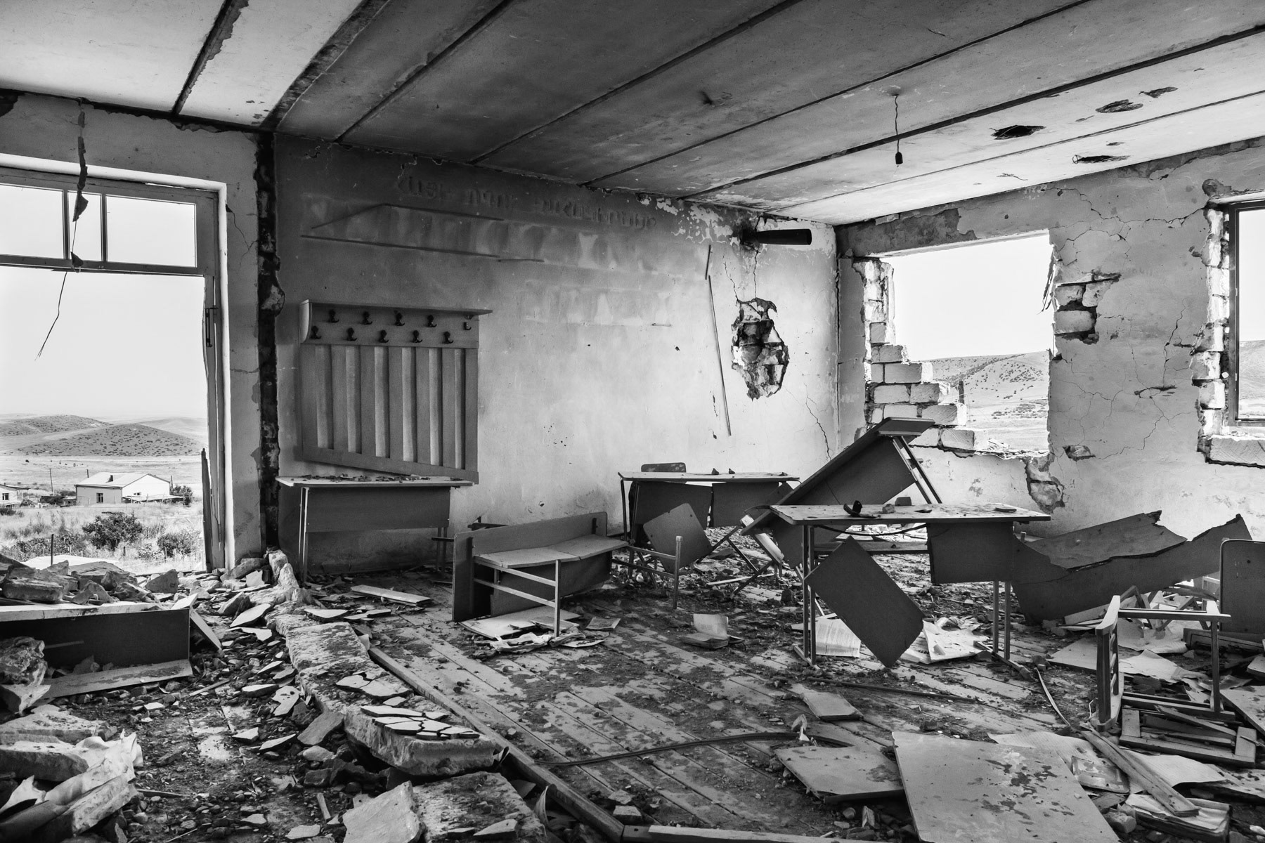 Abandoned classroom as the Armenian population fled the Azeri attack on the village during the April 2016 offensive. The school is heavily damaged as it is still today in direct line of fire. Talish school, Nagorno-Karabakh, August 2016