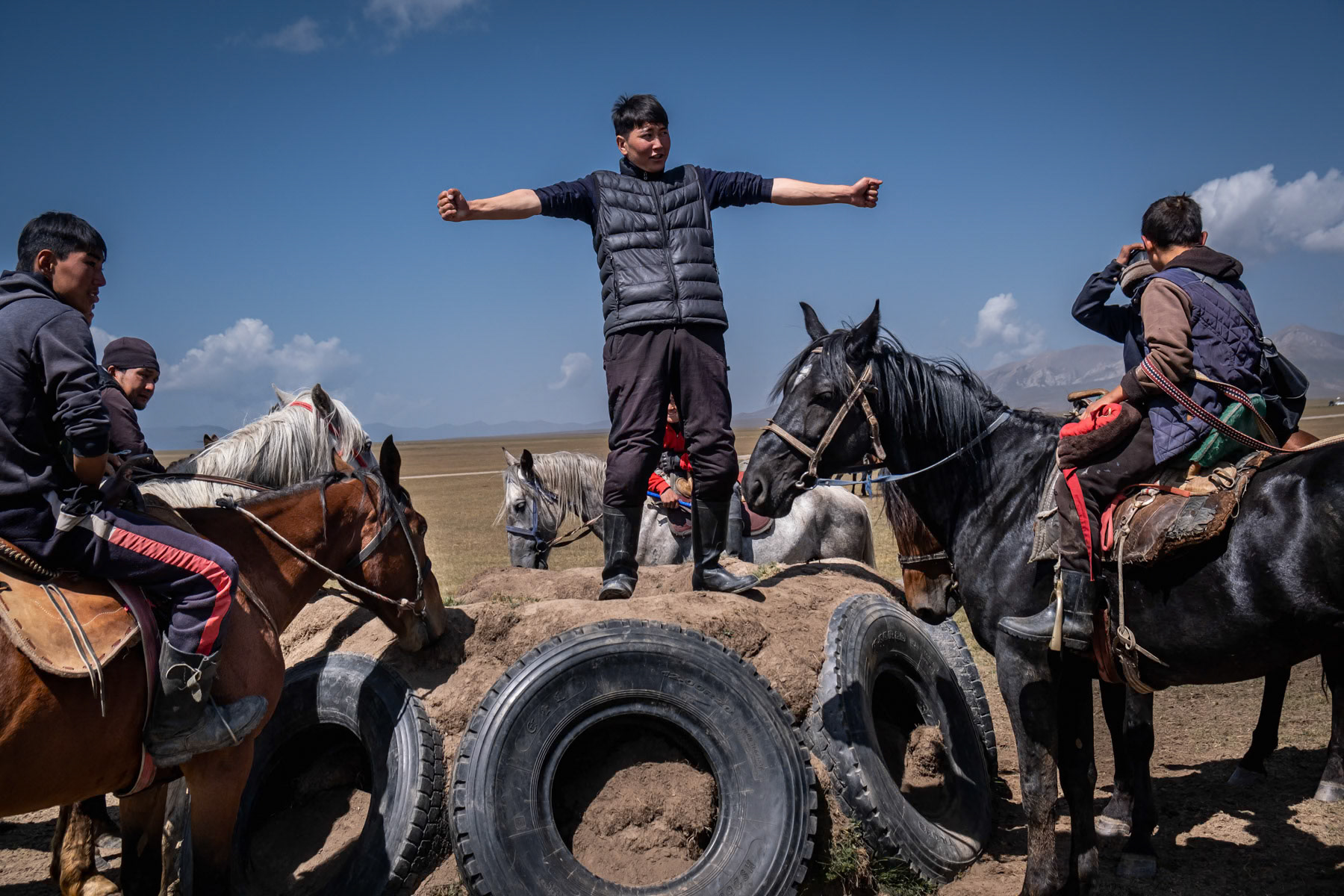Team motivation speech before a Kok Boru game. A traditional horseback game consisting of dropping a dead goat carcass in the opponents' goal. In Kyrgyzstan and generally Central Asia and Afghanistan it is considered a national sport and very popular. Son Kul Lake, Naryn region, Kyrgyzstan, August 2021