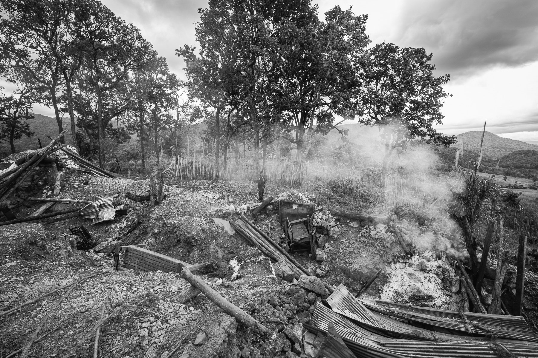 Three days after its capture by the KNLA on May 28, 2025, smoke still rises from the partly destroyed Junta military base at Kanele. Karen State, Myanmar