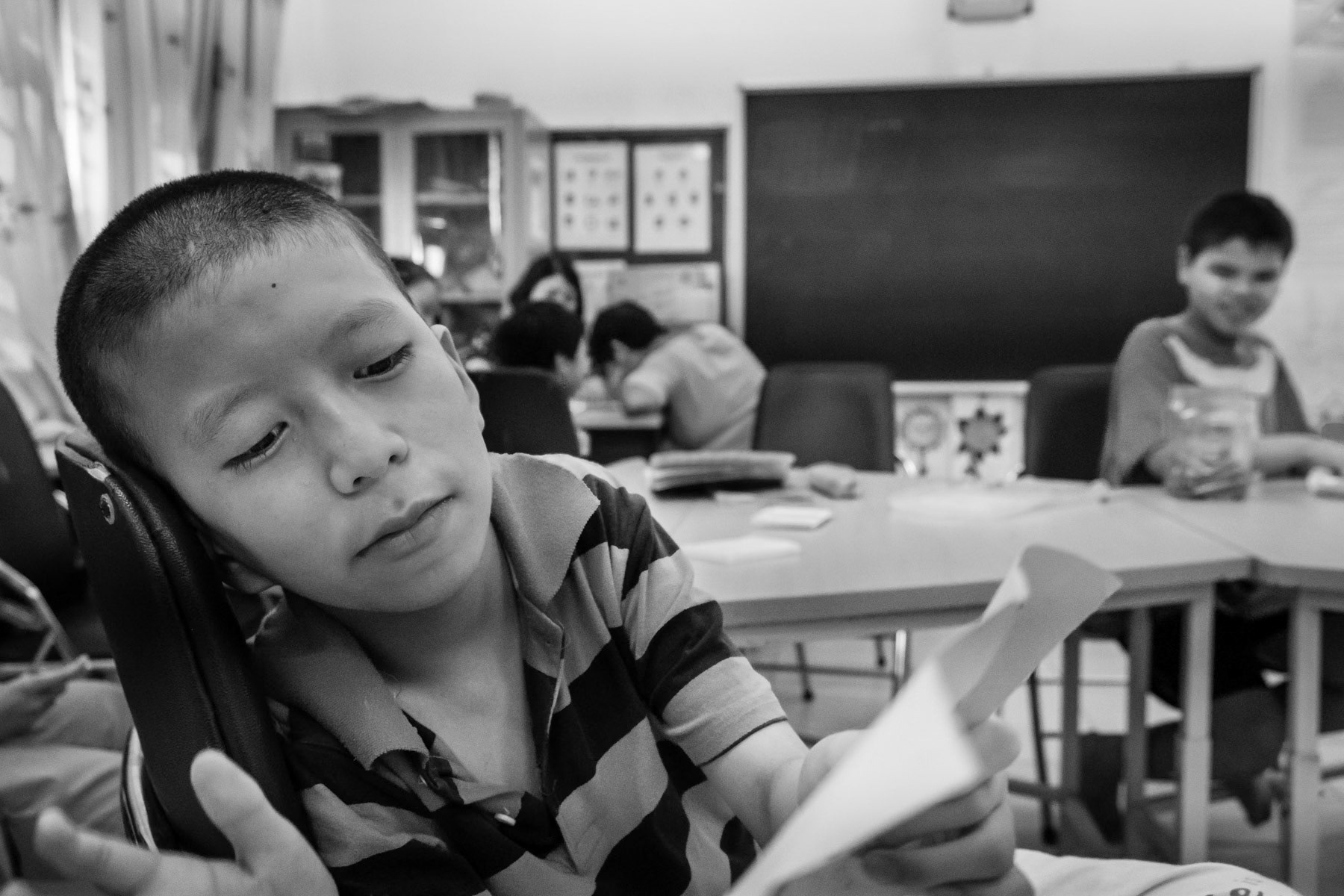 Agent Orange victim at the Friendship Village in Hanoi. Agent Orange is a chemical defoilant rich in dioxin that was massively used by the American Army in clearance operations during the Vietnam War. Although its use was stopped in 1971, almost 50 years later desendants of affected victims are still born with mental and/or physical problems due to the toxicity of the dioxin passed on through generations. Hanoi, Vietnam, June 2018