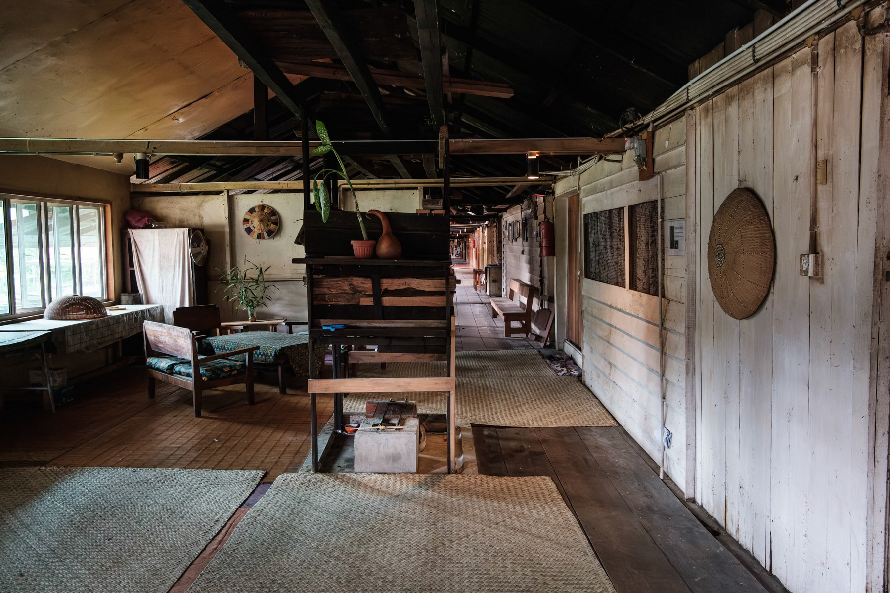 Interior of a traditional longhouse, the common habitat of indigenous people in Borneo. Bario, Sarawak, Malaysia, October 2023