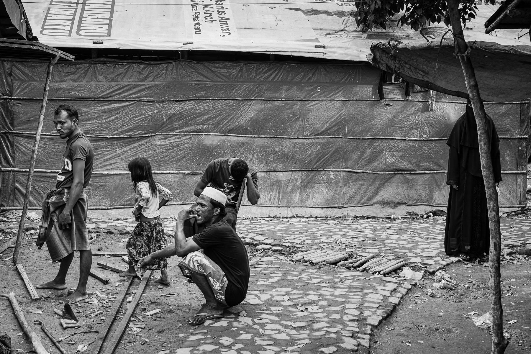 After enduring treacherous sea voyages, 600 Rohingya refugees find little respite in a camp plagued by insufficient clean water and sanitation, making it a breeding ground for disease. Pekanbaru, Sumatra, May 2025