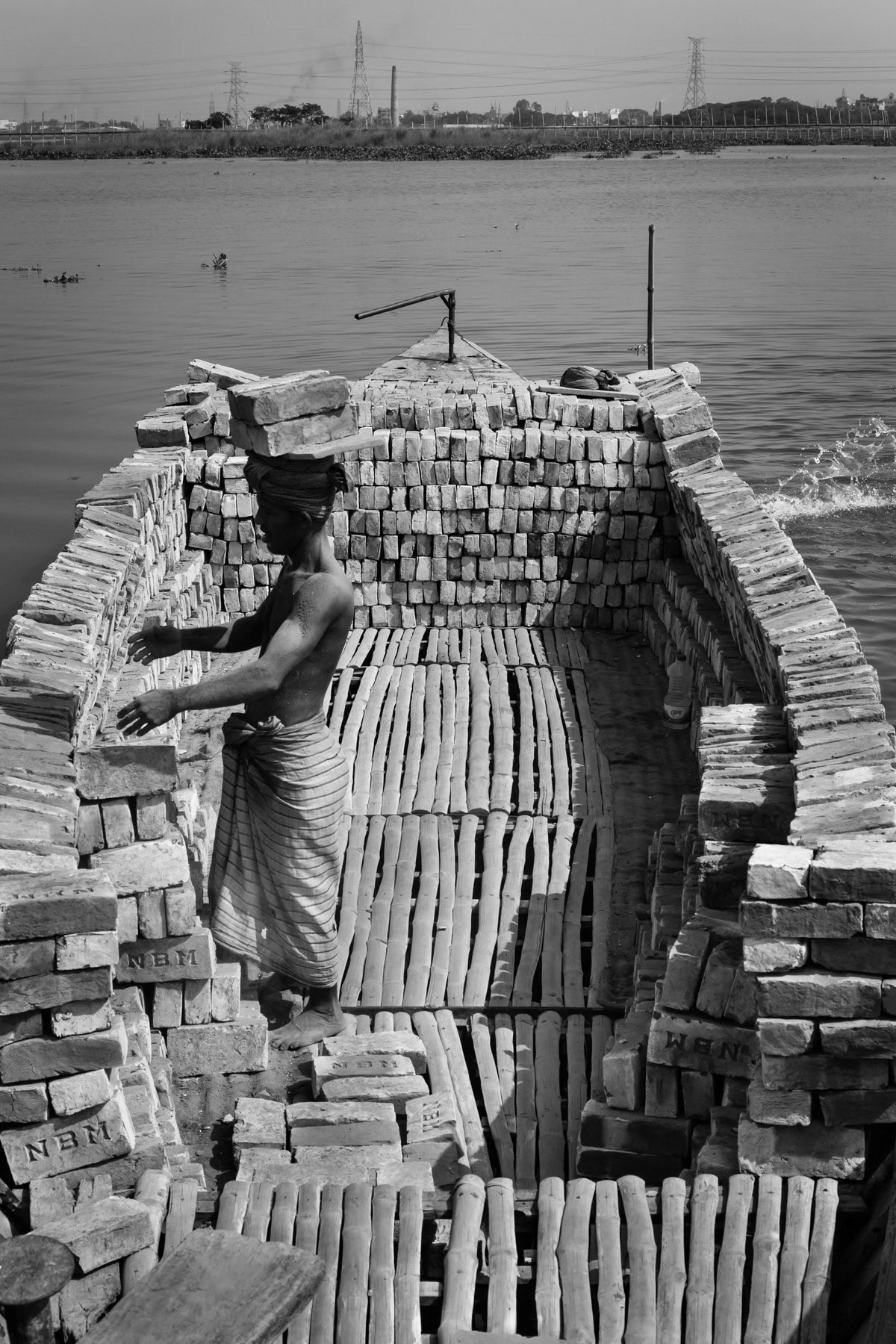 Loading the boat with finished bricks, Amin Bazar brick kilns, Bangladesh, May 2015,Bangladesh, May 2015