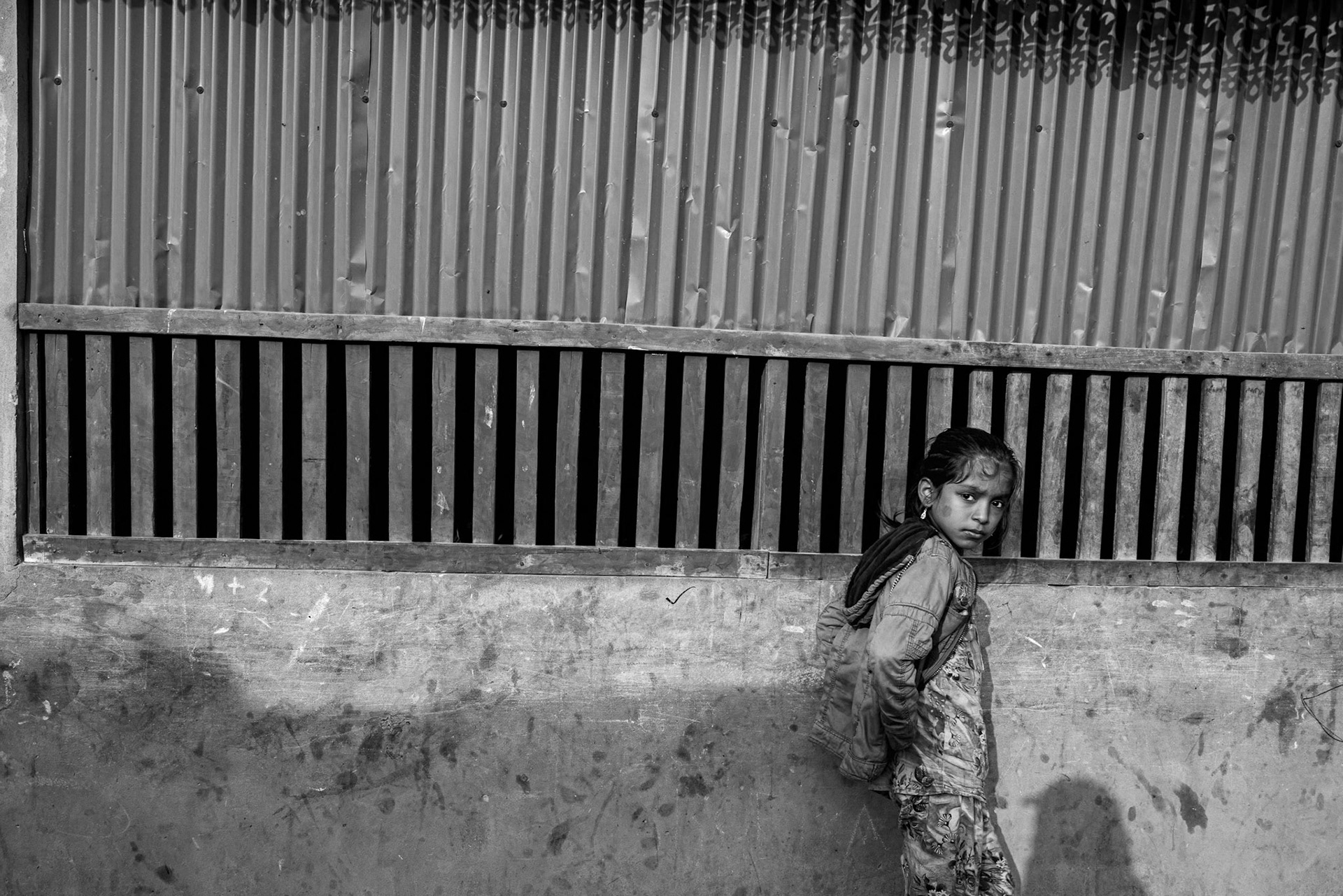 The gaze of the younger generation reflects the uncertainty of a future spent in a camp where formal employment and education are largely unavailable. Balukhali camp, Bangladesh, January 2026