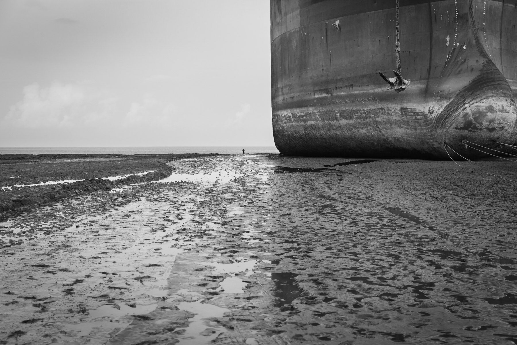 The vessels reach their final destination when they are beached during high tide. They will consequently be cut in pieces on the beach by ship cutters. Recently beached ship at his final destination where it will be dismanteled on the spot, Chittagong ship-breaking yards in the Bay of Bengal, Bangladesh, June 2015
