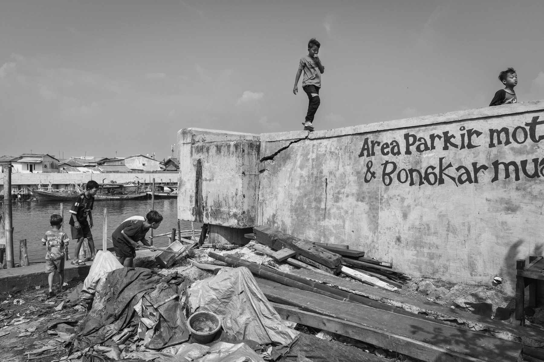 Part of the seawall structure built along the shore of the greater Jakarta Bay as a protection against a rising sea. Marunda neighbourhood, Jakarta, Indonesia, June 2022
