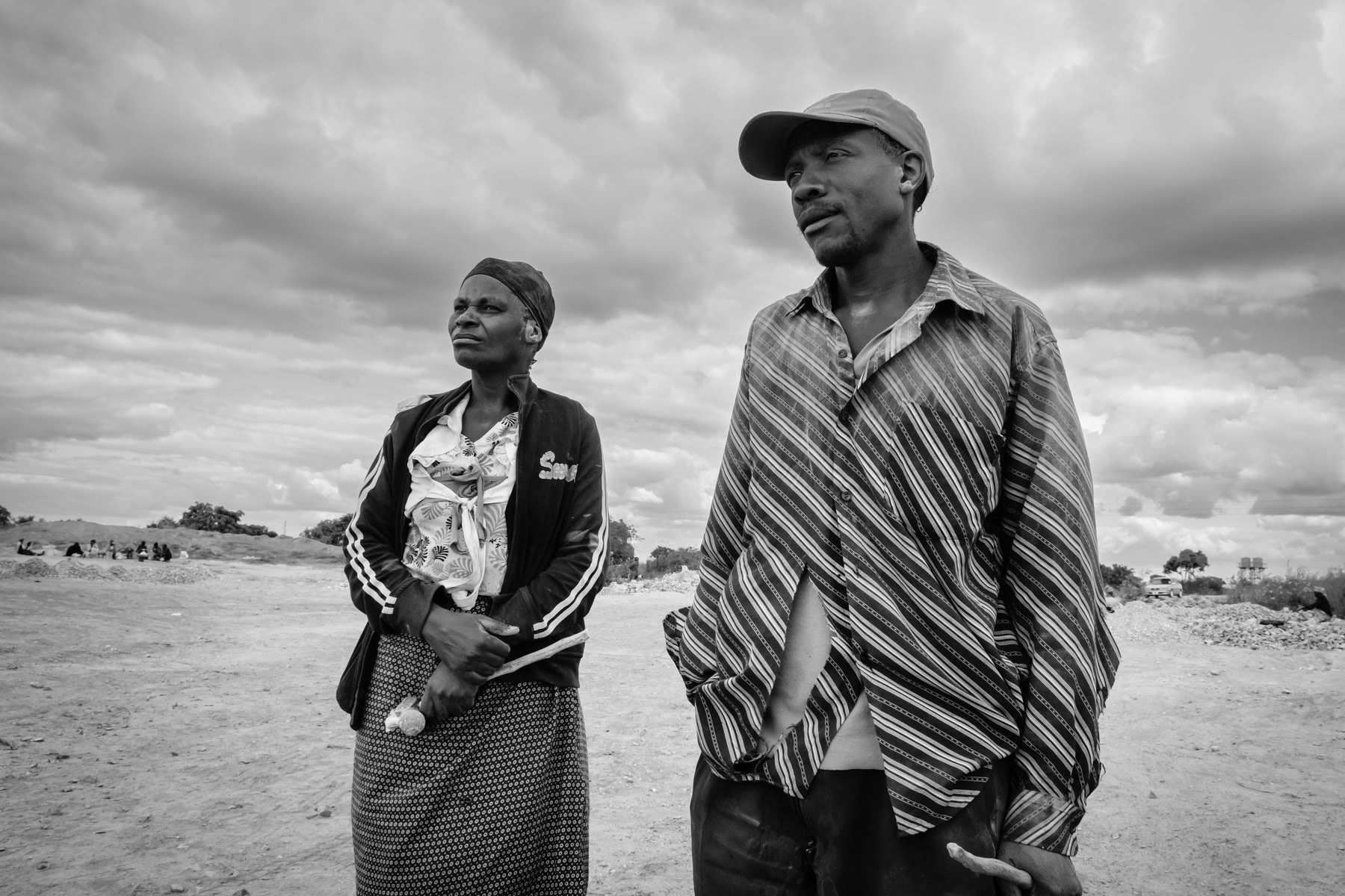Residents of Makululu working in a small scale open pit mine opened as a community empowerment project. All hard labour is done manually and wages are extremely low. Kabwe, Zambia, May 2021