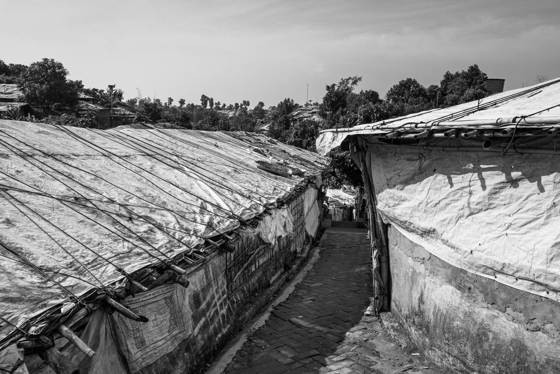 Makeshift shelters stretch across Kutupalong camp, providing temporary refuge for Rohingya families fleeing violence in Rakhine, with approximately 150,000 new arrivals since early 2024. Kutupalong refugee camp, Cox's Bazar, Bangladesh, September 2025