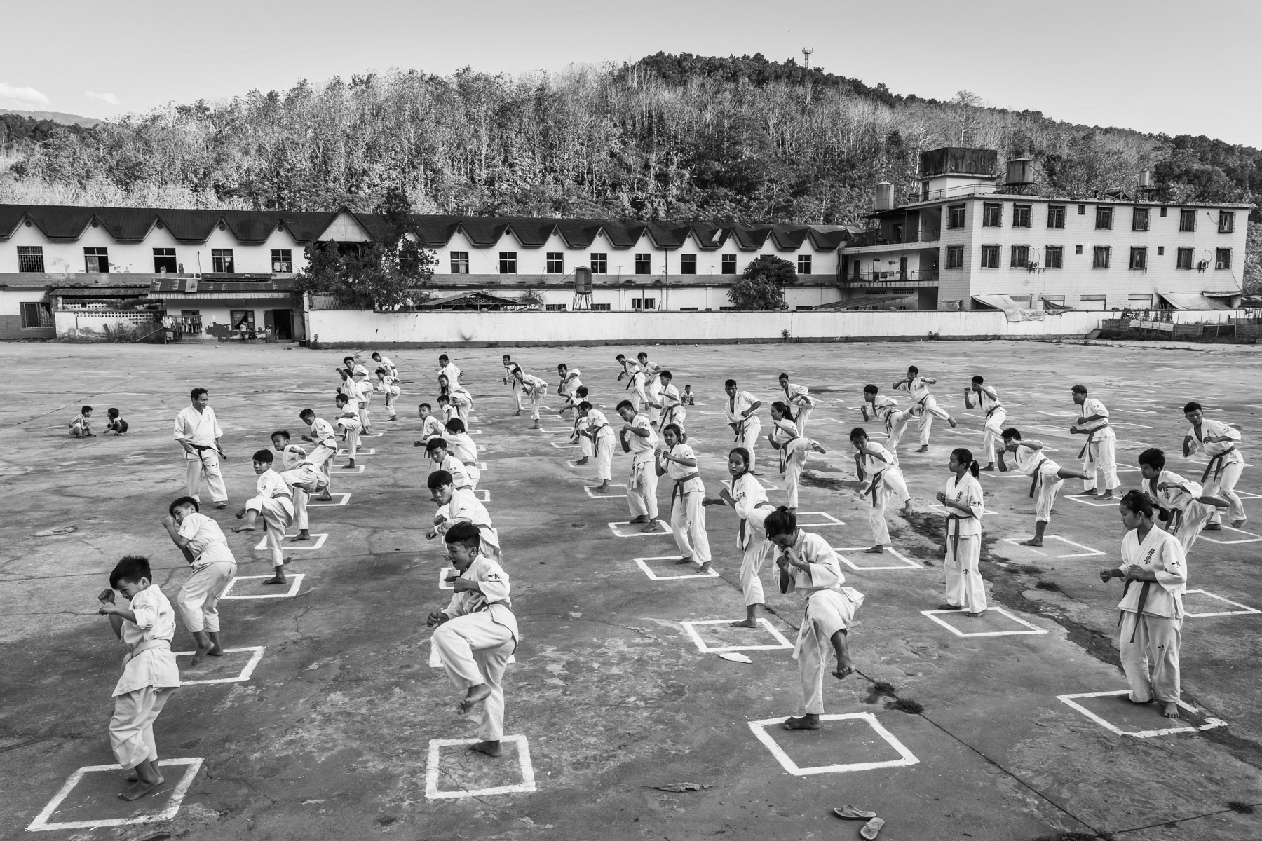 Kachin youth practising martial arts part daily self defense and sports activities. Laiza, the stronghold of the Kachin Independence Organisation controlled territory along the Chinese border. Laiza, Myanmar, April 2019
