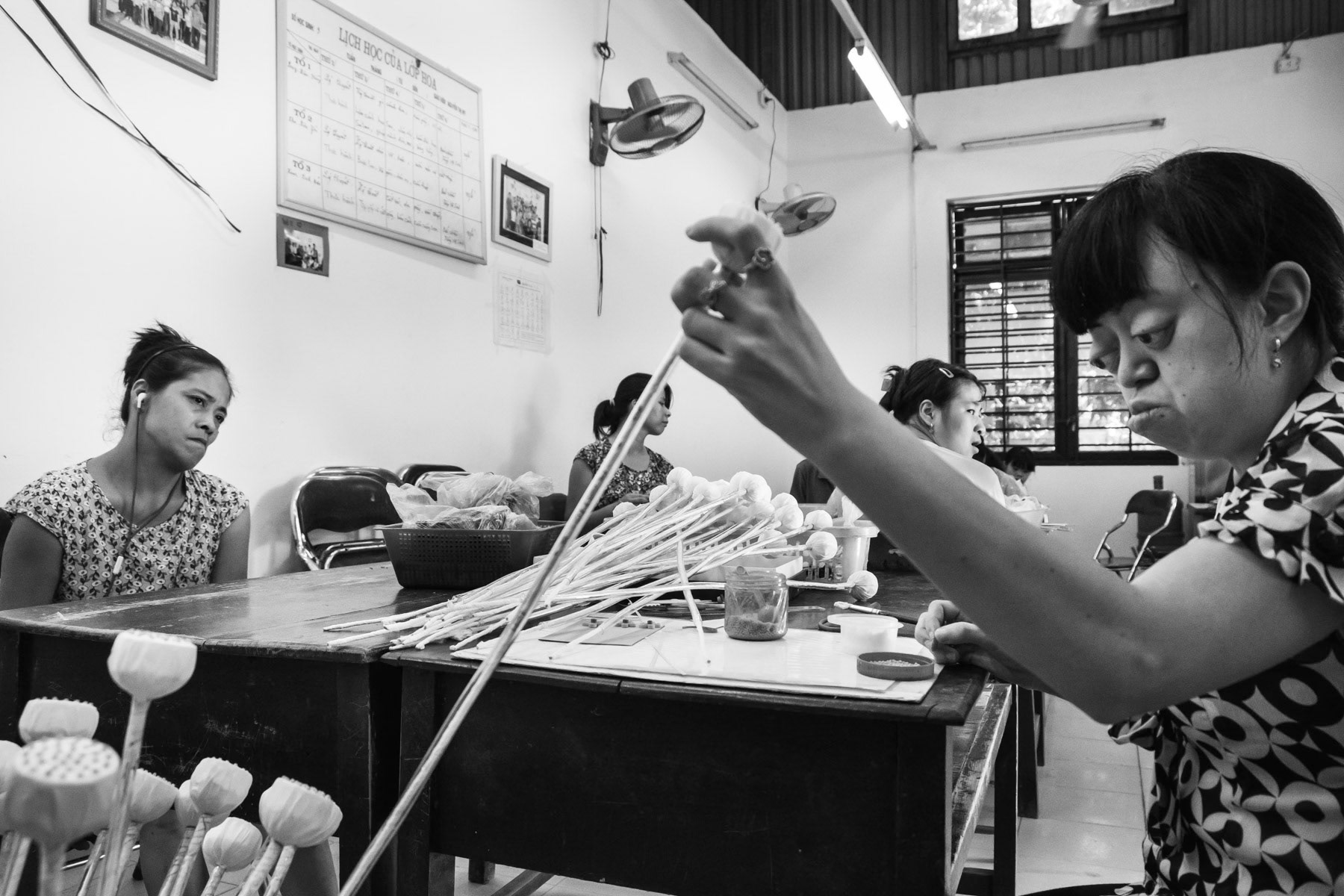 Agent Orange victims making paper flowers at the Friendship Village in Hanoi. Agent Orange is a chemical defoilant rich in dioxin that was massively used by the American Army in clearance operations during the Vietnam War. Although its use was stopped in 1971, almost 50 years later desendants of affected victims are still born with mental and/or physical problems due to the toxicity of the dioxin passed on through generations. Hanoi, Vietnam, June 2018