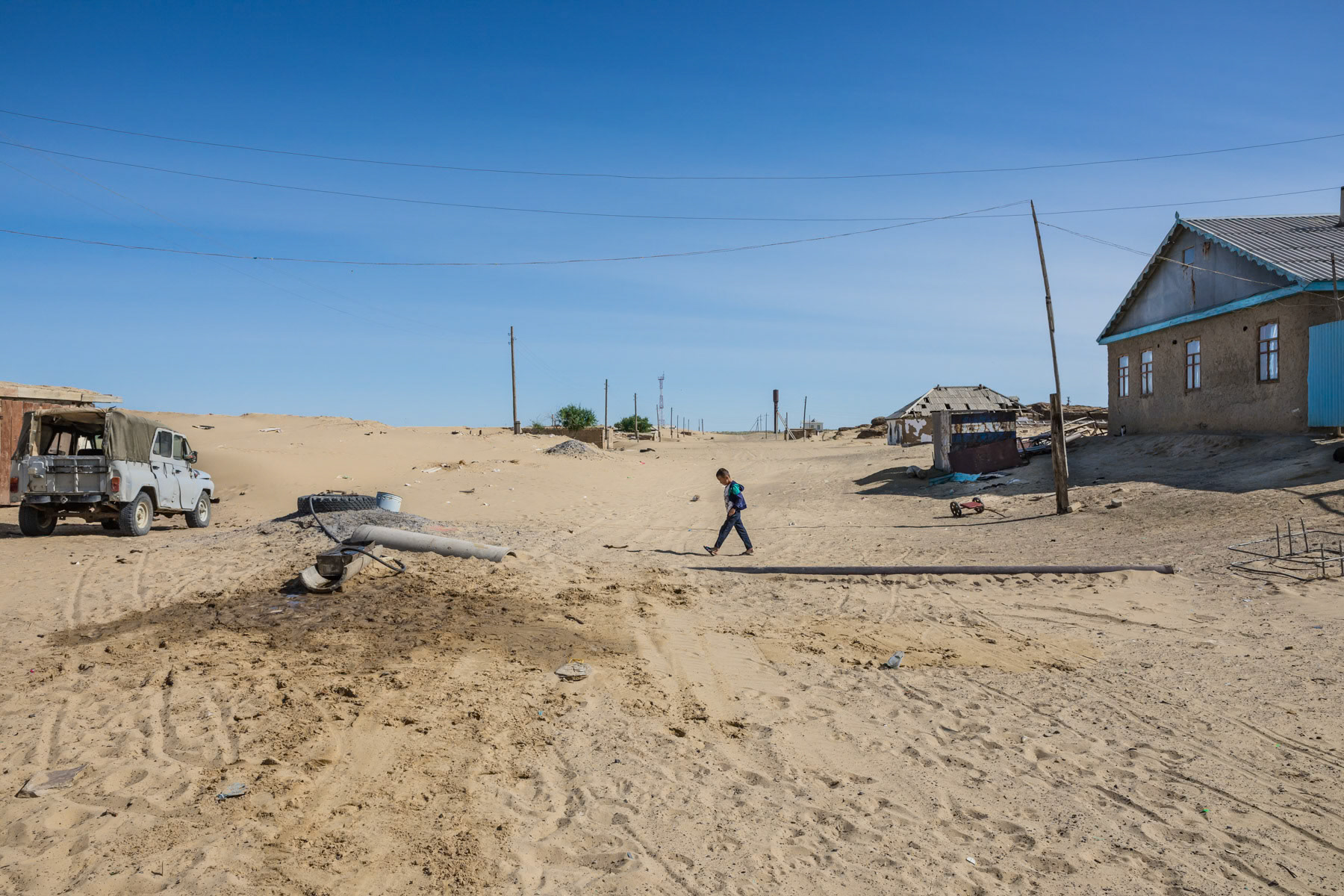 A village slowly overtaken by the desert. Akispey village used to be an important village along the shore of the Aral Sea but is now almost one hour drive to the closest access point. Aral Sea, Kazakhstan, June 2019