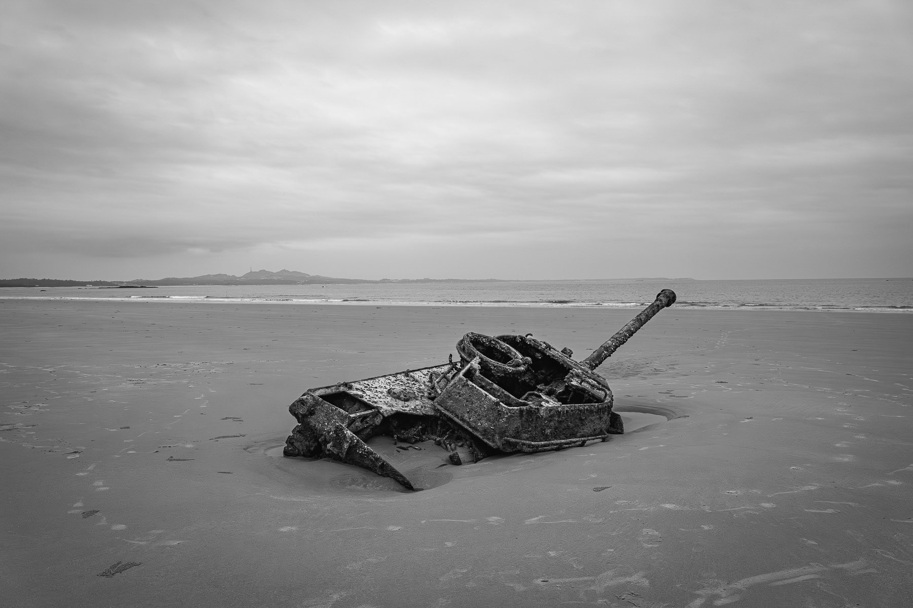 On Kinmen's coast, an old tank now lies abandoned, a relic of past tensions. Lieyu beach on Kinmen island, Taiwan, May 2025
