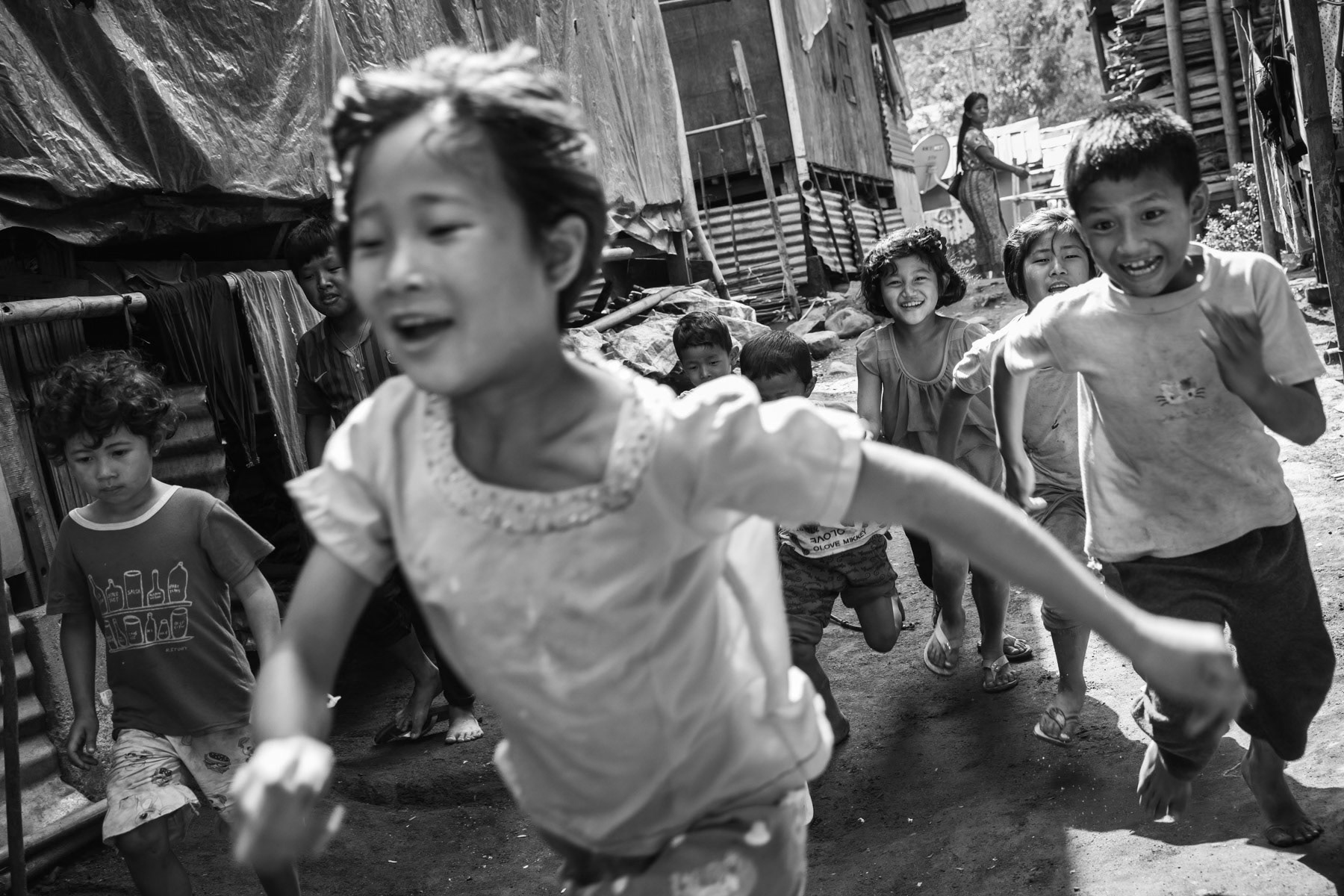 Kachin children playing in an IDP camp along the border with China in Kachin Independence Army (KIA) held territory in Myanmar. More than 8700 displaced Kachin live in Je Yang camp one hour south of Laiza, the stronghold of the KIA. Je Yang camp in Laiza Township, Myanmar, April 2019