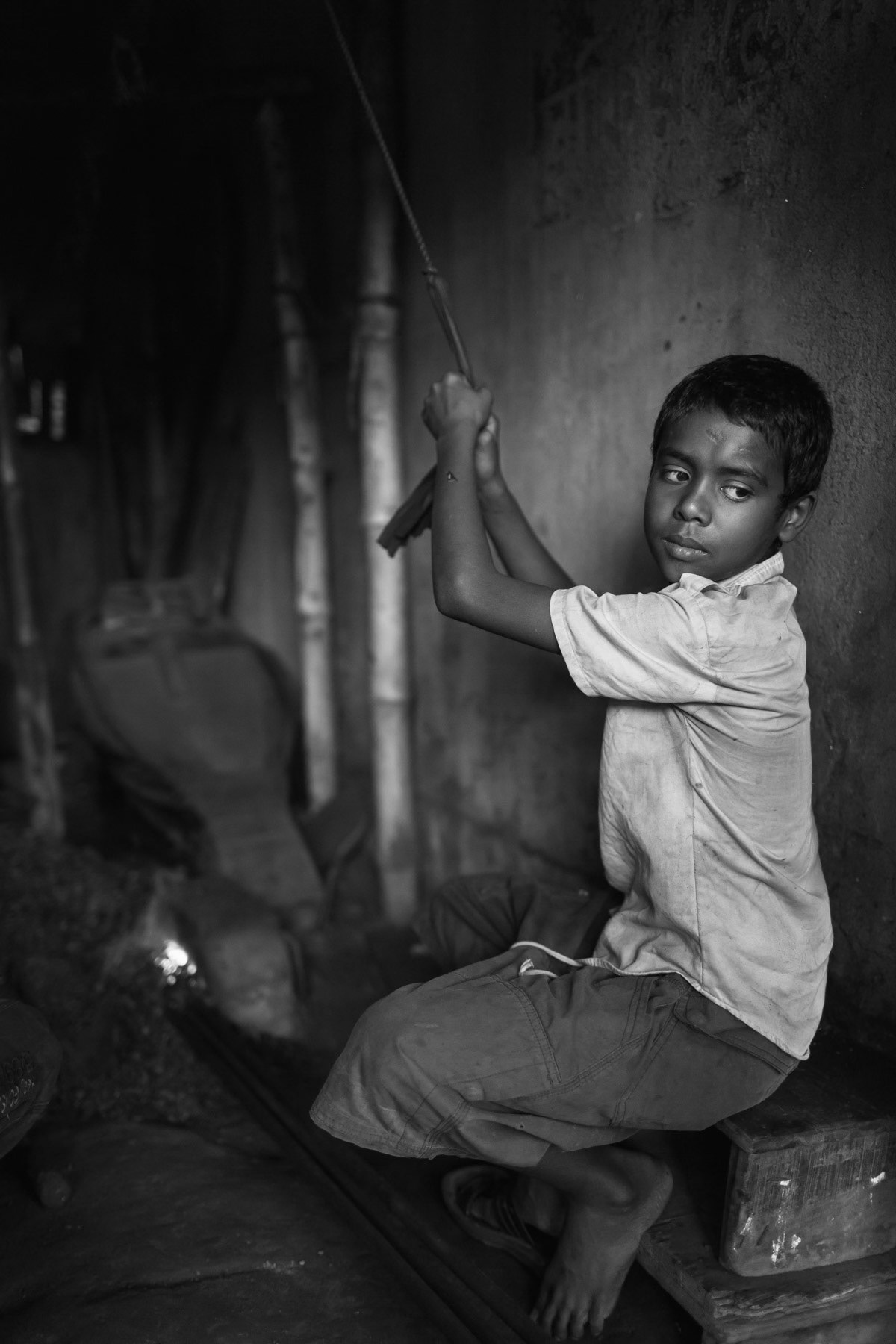 Child working in a metal workshop, Hazirabagh tanneries, Dhaka, Bangladesh, October 2014