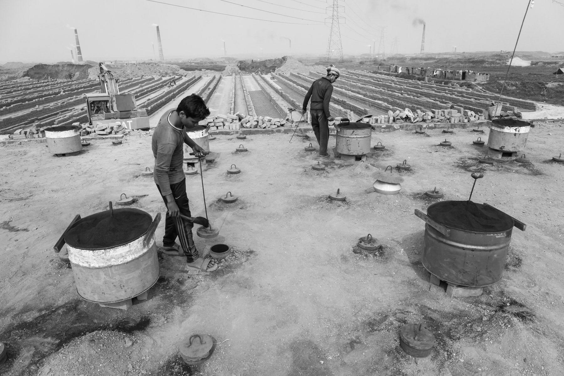 The fire in the brick kiln will be maintained throughout the 8 months production period during which air pollution in and around Dhaka reach alarming levels, Amin Bazar brick kilns in Dhaka suburbs, Bangladesh, December 2015