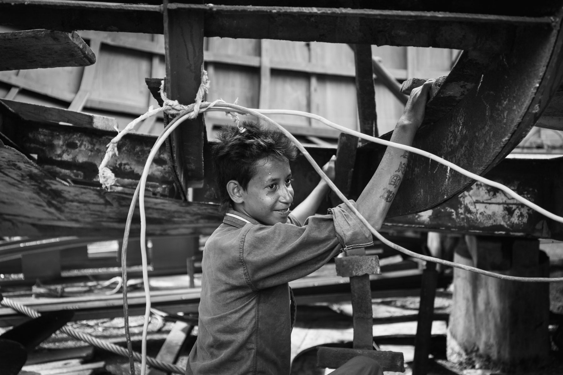 Young helper at the shipyards along the Pushur river, Khulna, Bangladesh, May 2015