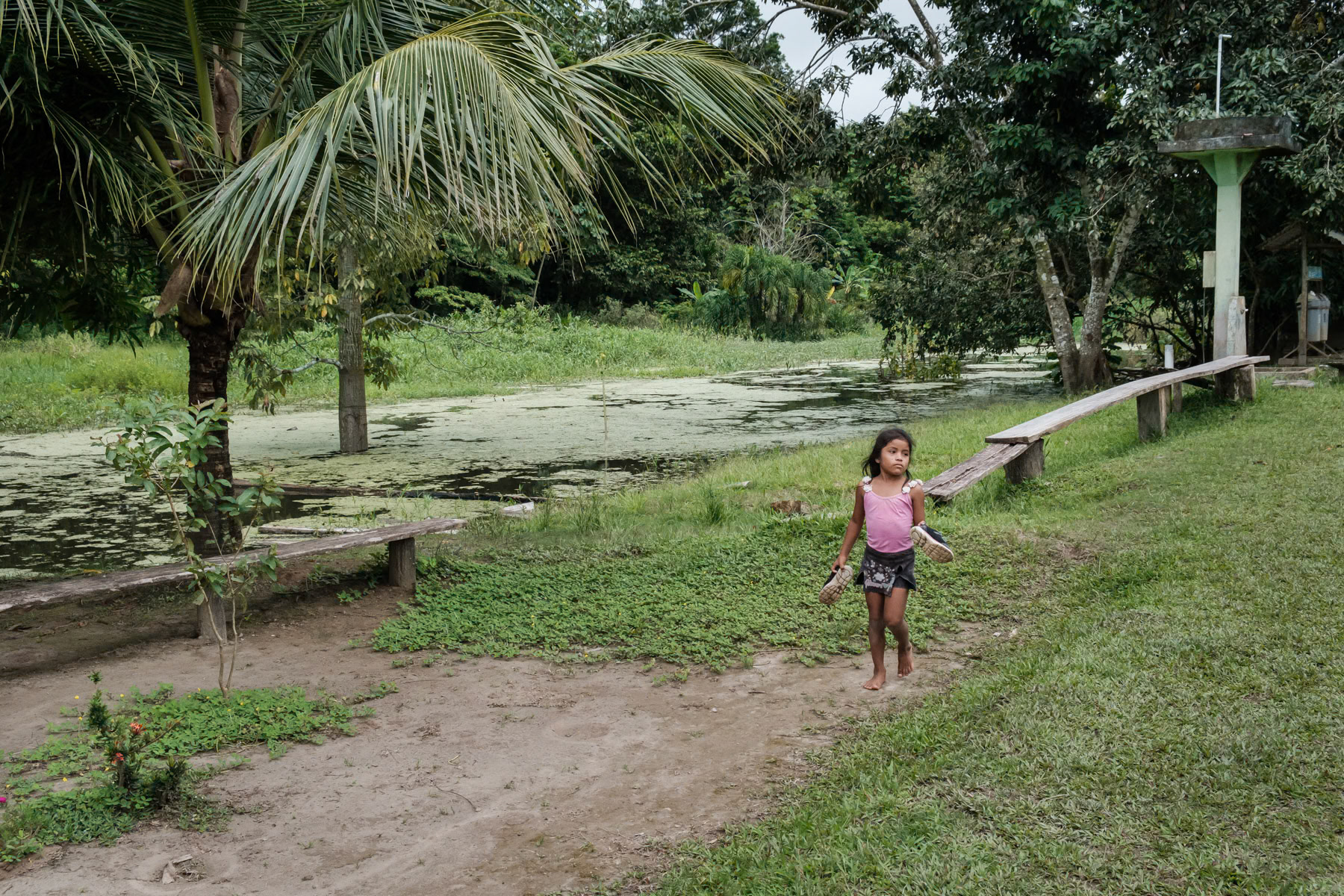 A little girl from the Ticuna community in her village of San Antonio de Cacao in the Amazonian part of Peru, April 2022