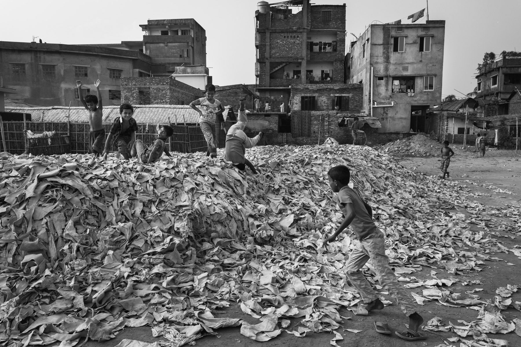 Kids playing on soft waste leather, Hazaribagh, Bangladesh, October 2014