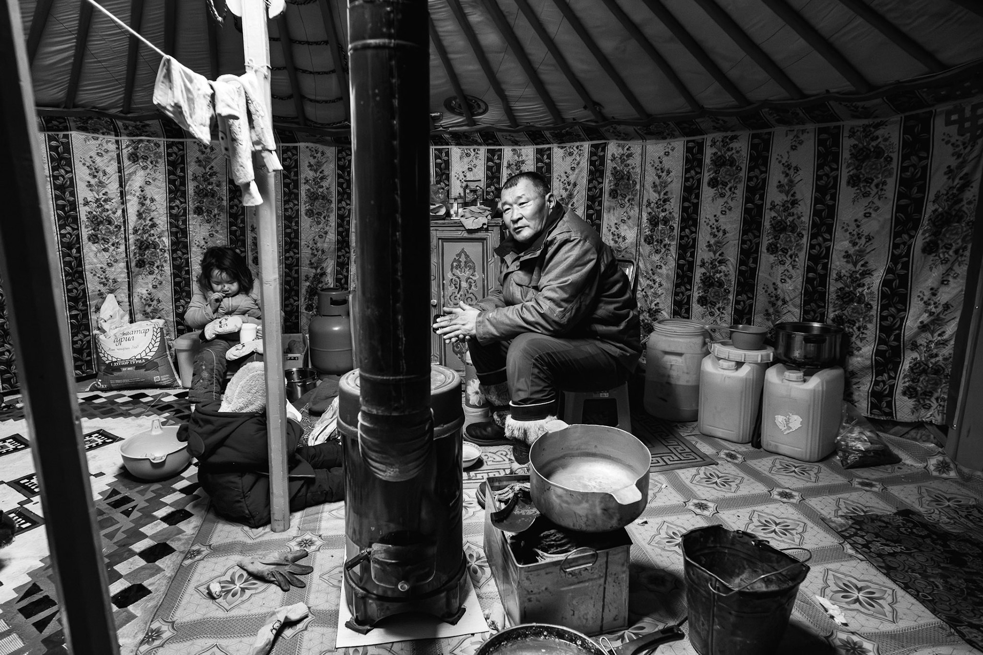 The grandfather maintains the traditional household while the working-age generation migrates to the city. Gobi desert, Mongolia, December 2025