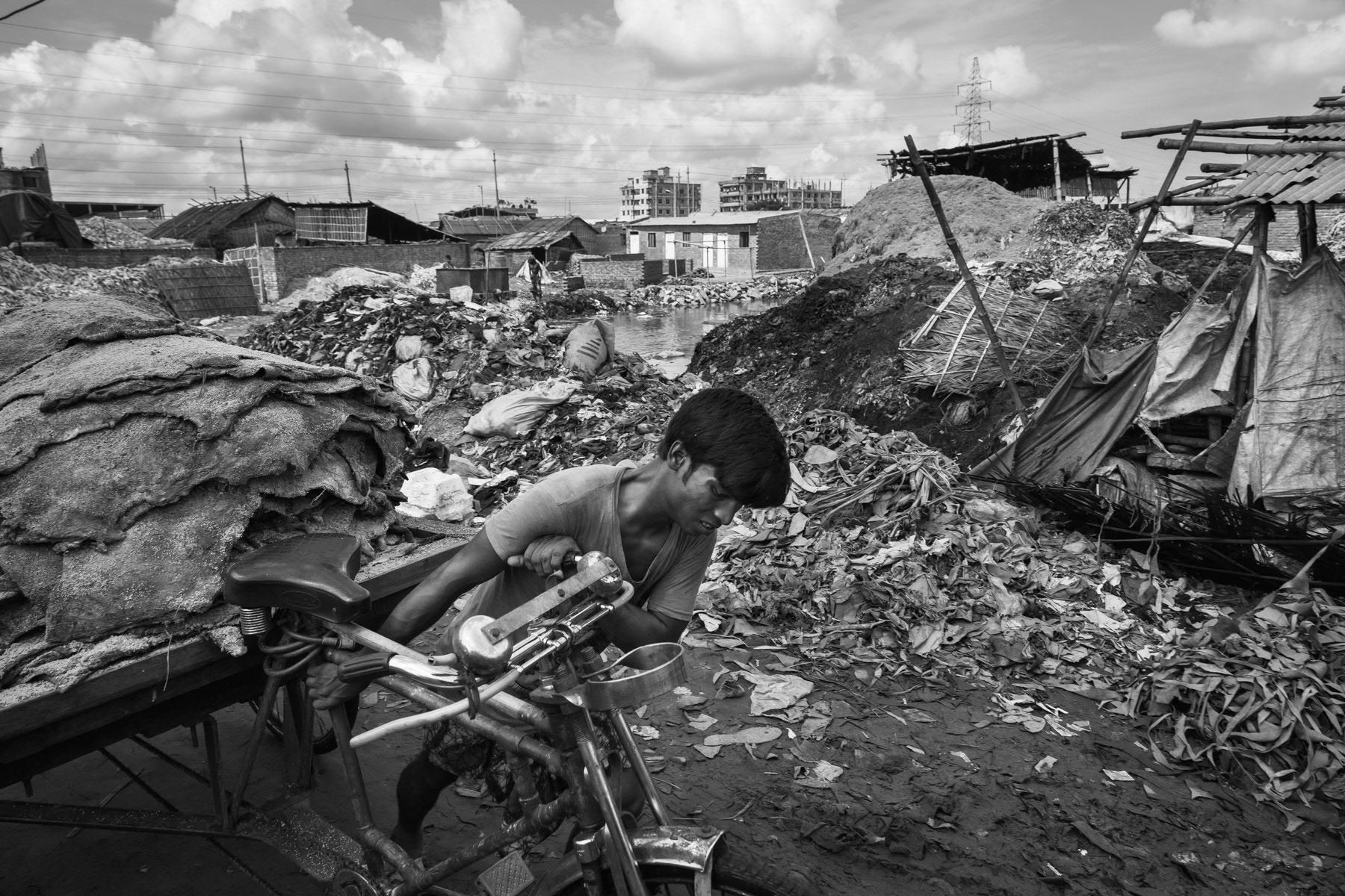 Rickshaw puller transporting skins to the tanneries, Hazaribagh, Bangladesh, October 2014