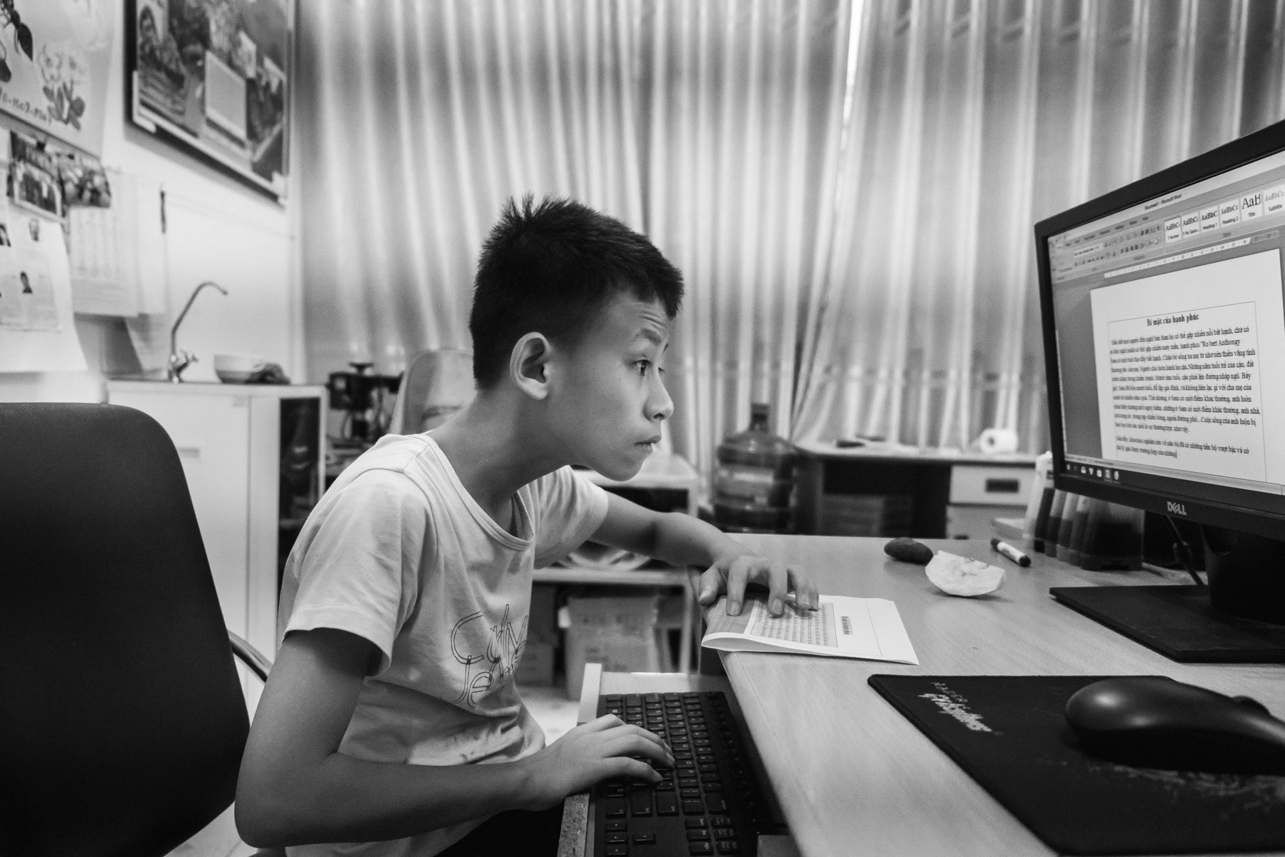 Agent Orange victim taking IT lessons at the Friendship Village in Hanoi. Agent Orange is a chemical defoilant rich in dioxin that was massively used by the American Army in clearance operations during the Vietnam War. Although its use was stopped in 1971, almost 50 years later desendants of affected victims are still born with mental and/or physical problems due to the toxicity of the dioxin passed on through generations. Hanoi, Vietnam, June 2018