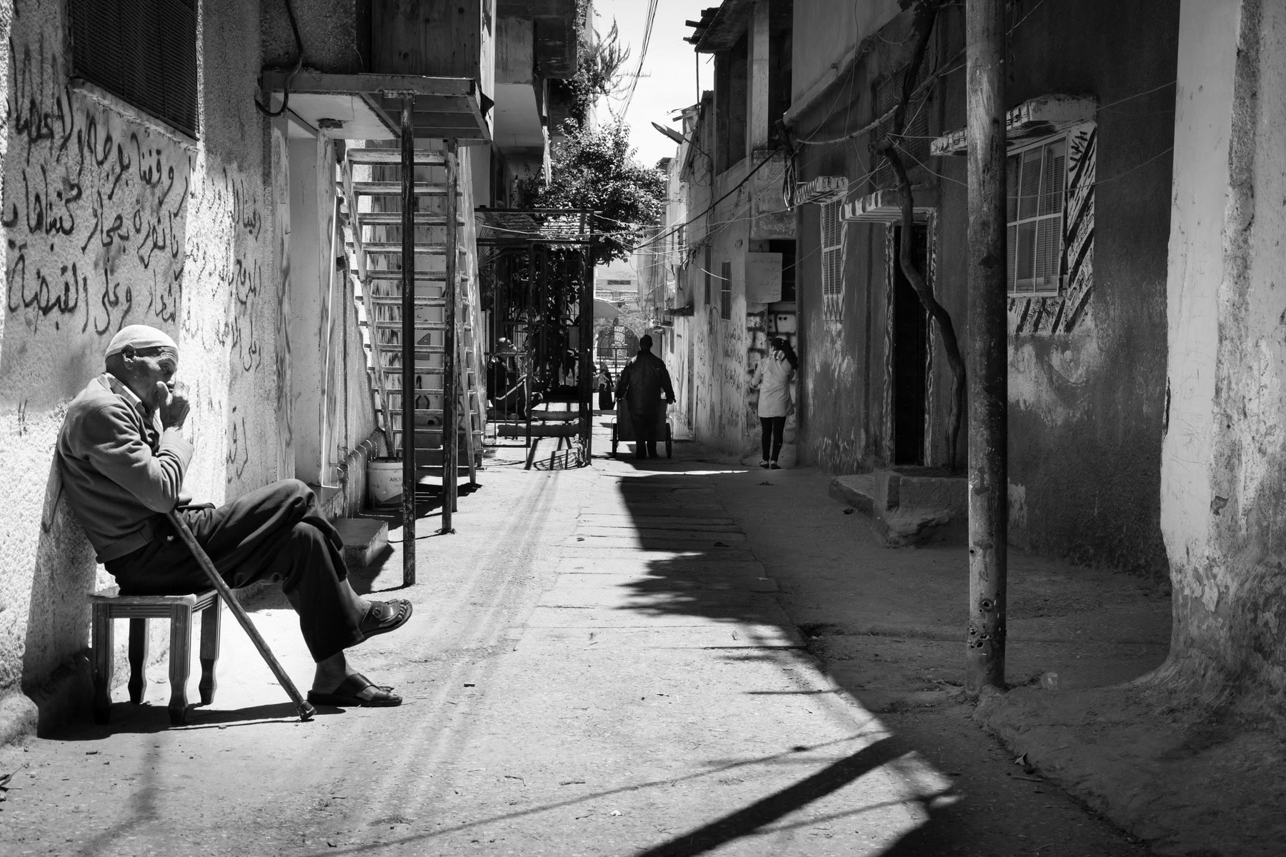Eldery man in one of the main streets of Balata Camp, Palestine, May 2014