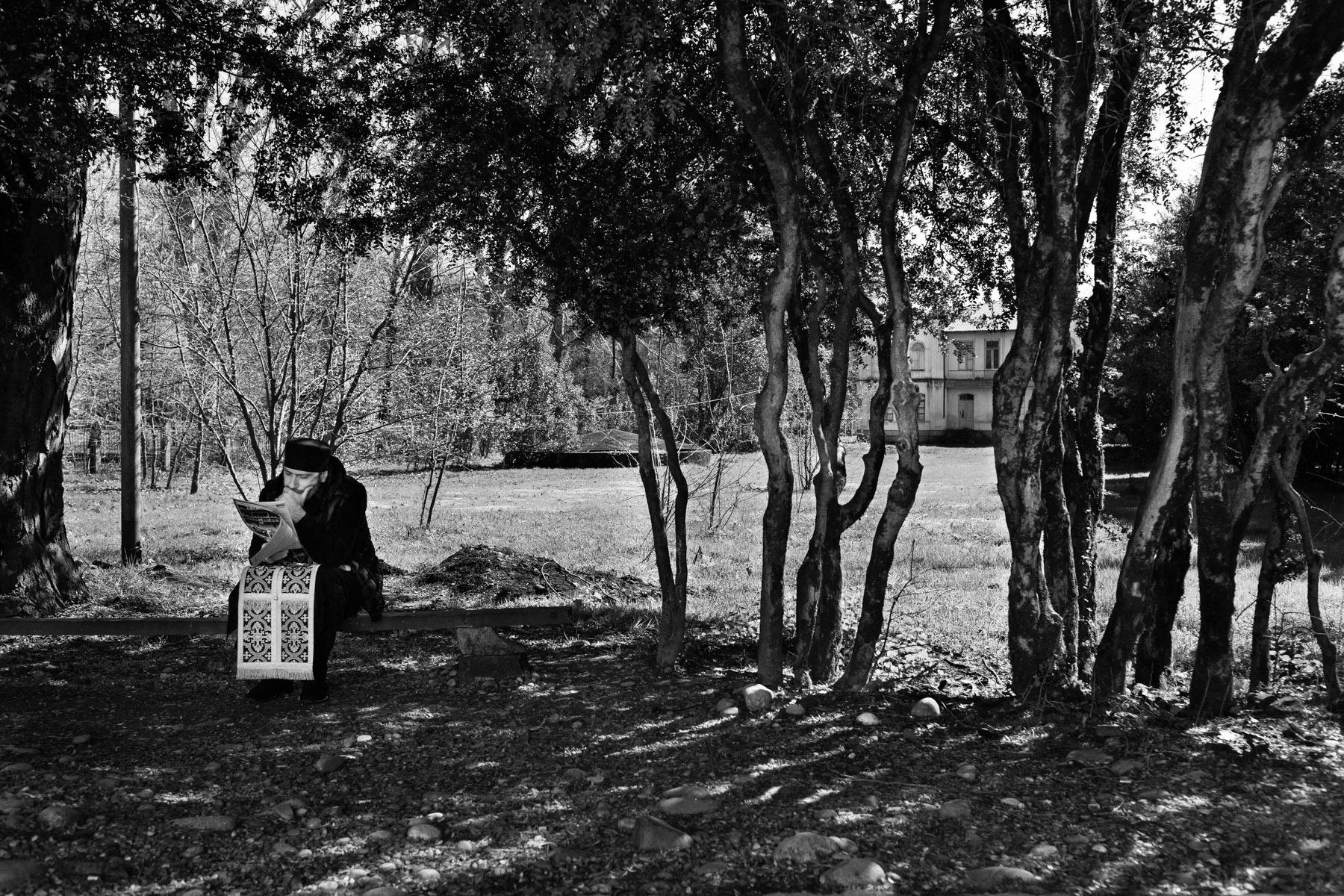 Priest in the Zugdidi gardens, Georgia. March 2014