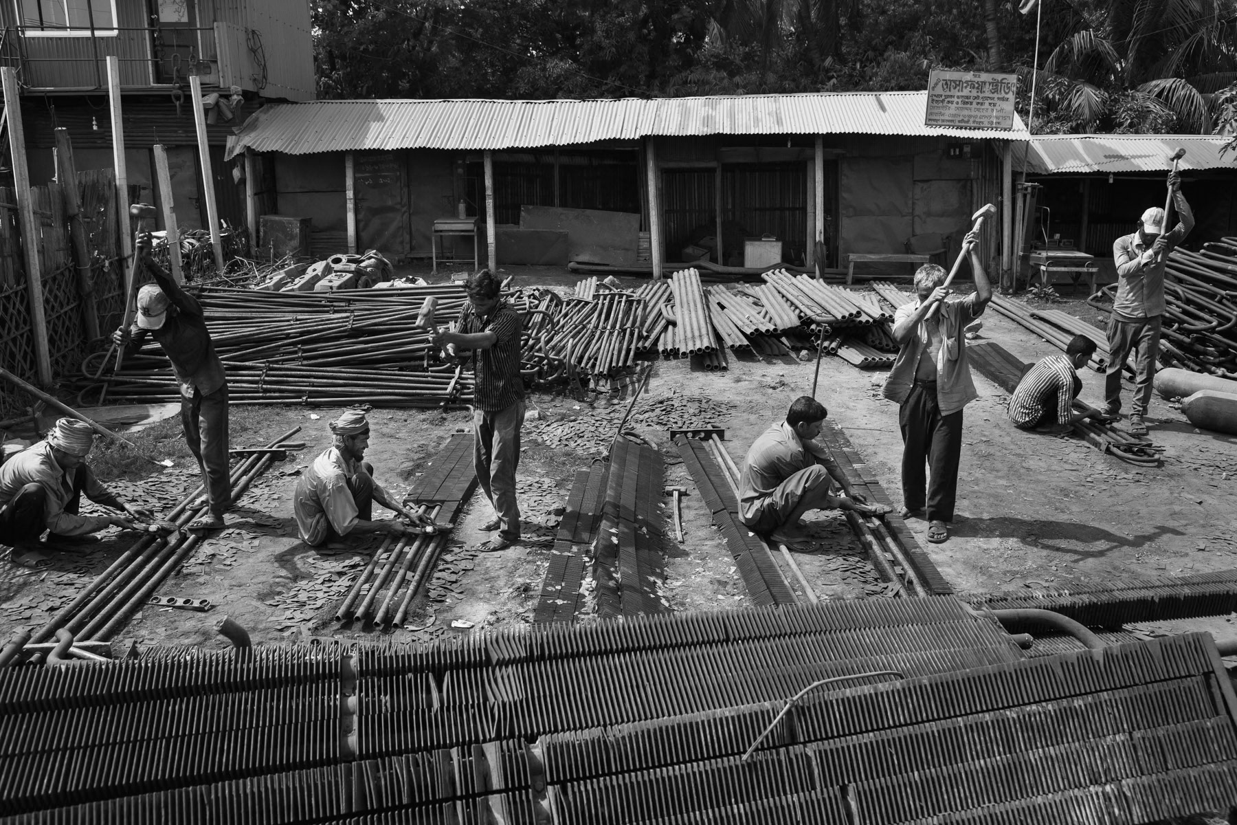 Hammering boat parts apart for further use, Bhatiary ship breaking yards, Bangladesh, October 2014